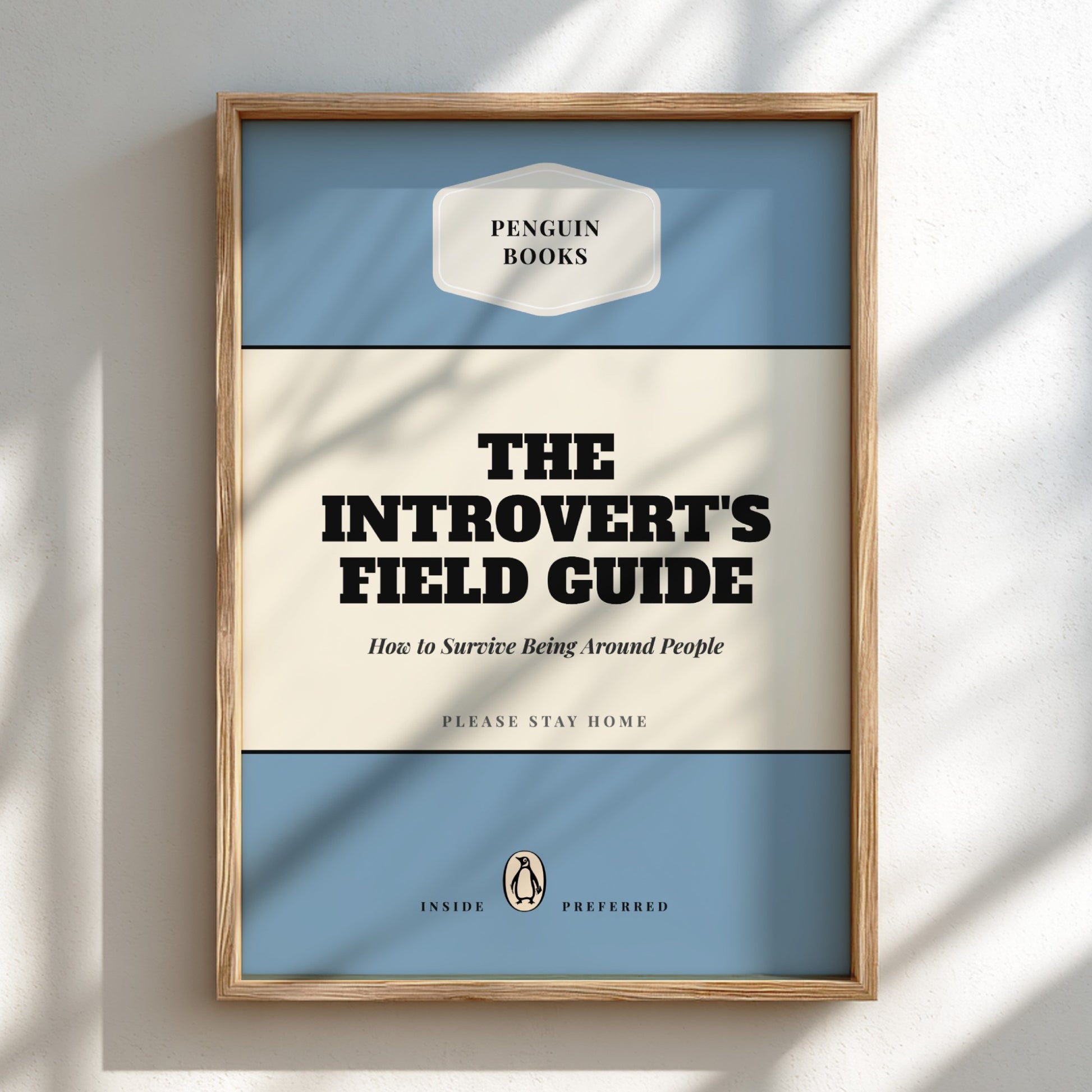 Framed book cover of 'The Introvert's Field Guide' by Penguin Books on a light background