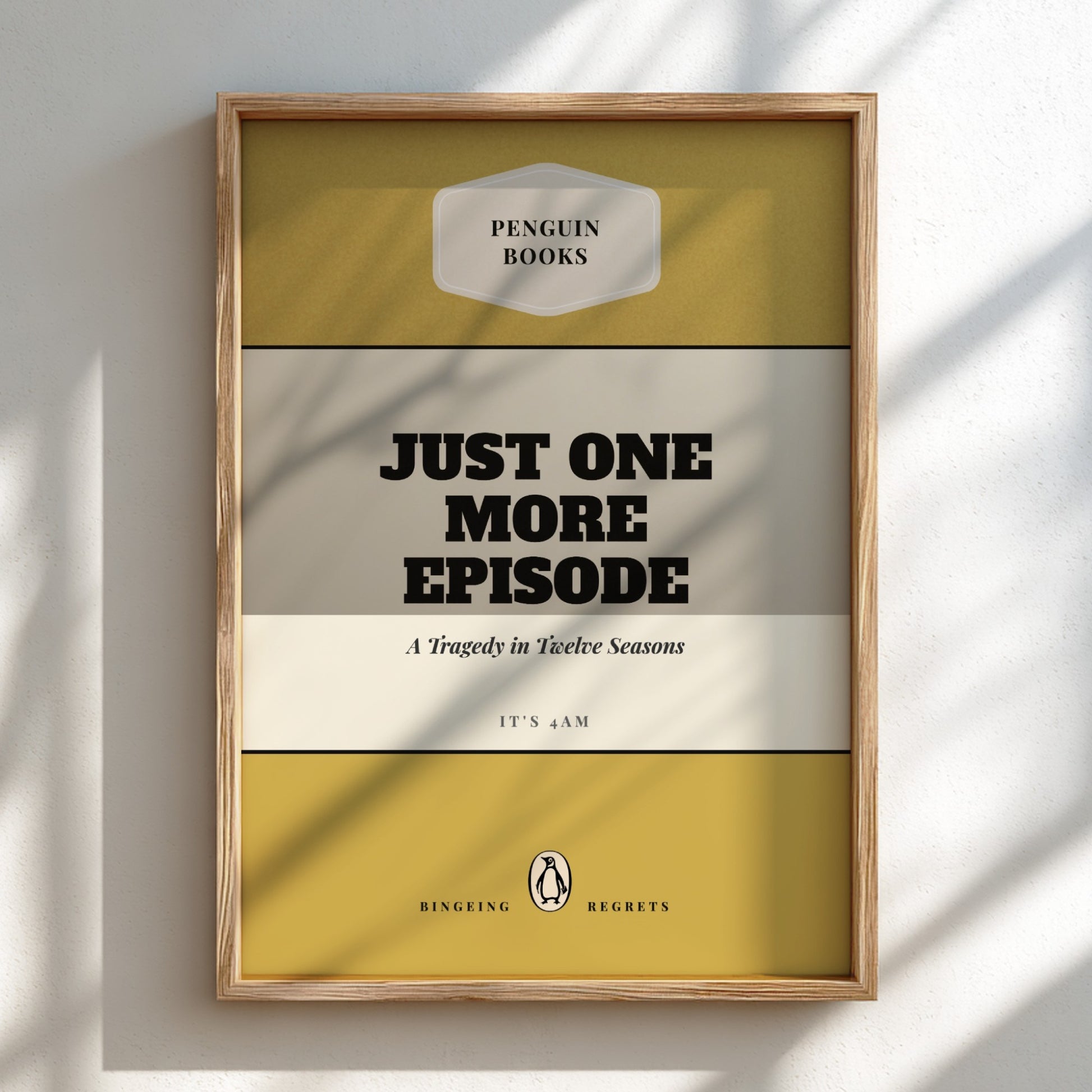 Framed book cover with 'Just One More Episode' text on a light background