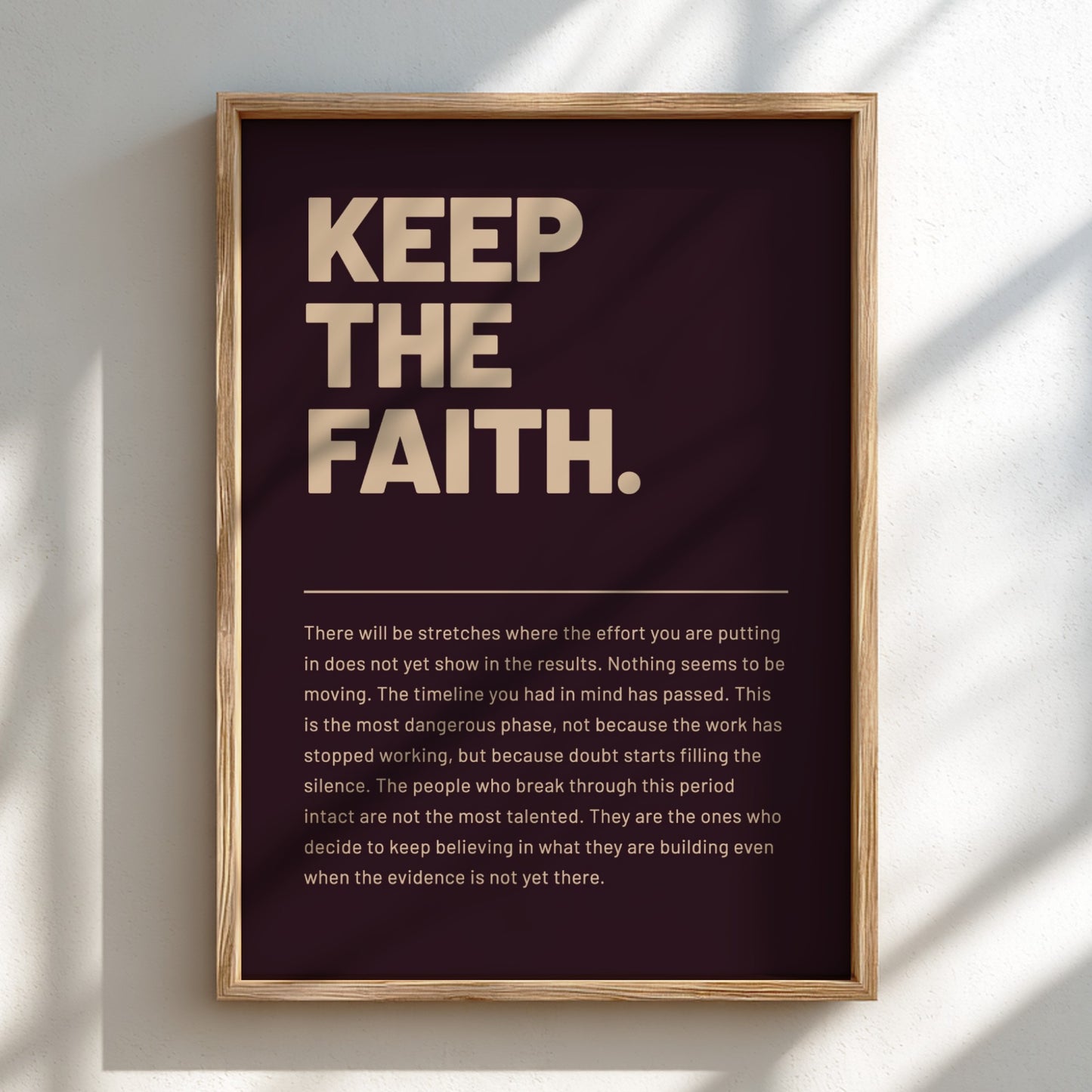 Framed poster with motivational quote 'Keep the Faith' on a dark background