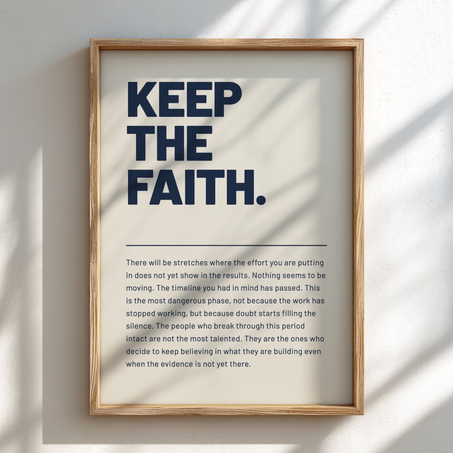 Framed motivational poster with text on a light background