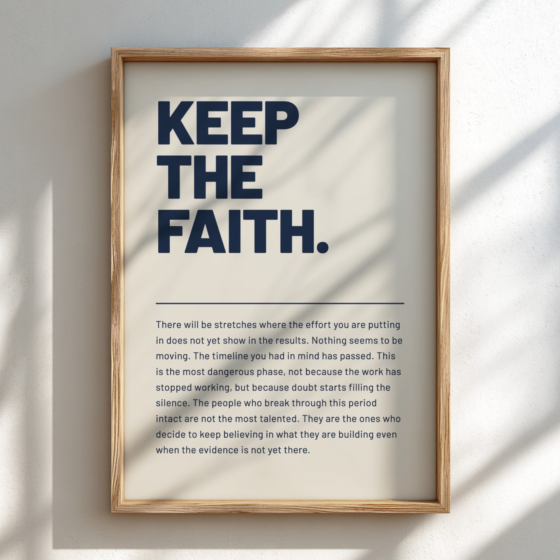 Framed motivational poster with text on a light background