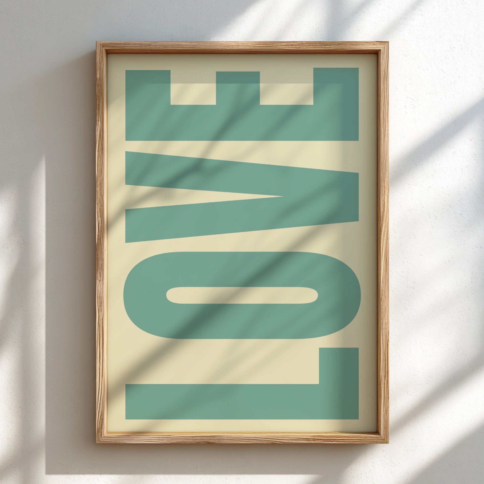 Framed artwork with the word 'LOVE' in teal letters on a beige background