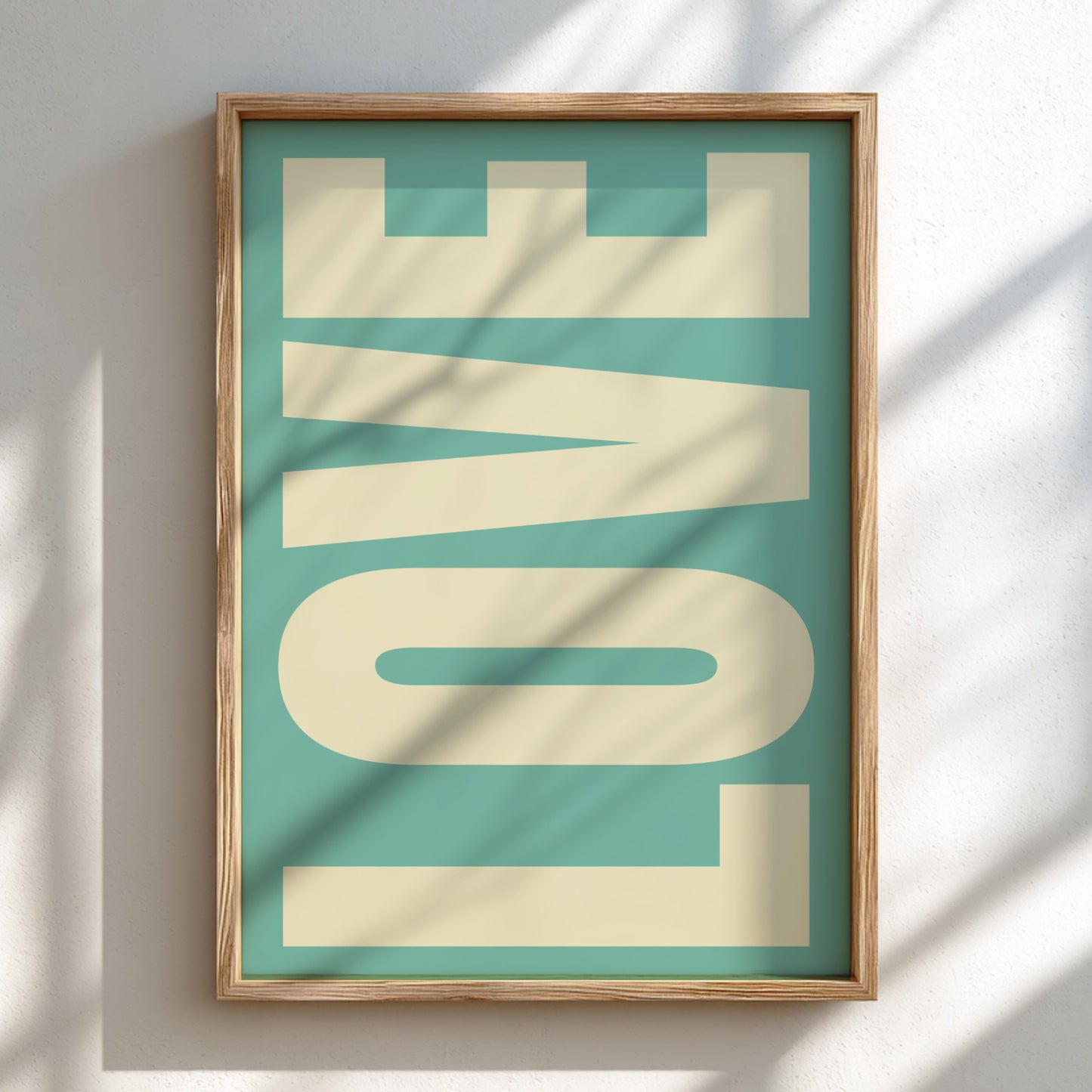 Framed artwork with 'LOVE' on a teal background