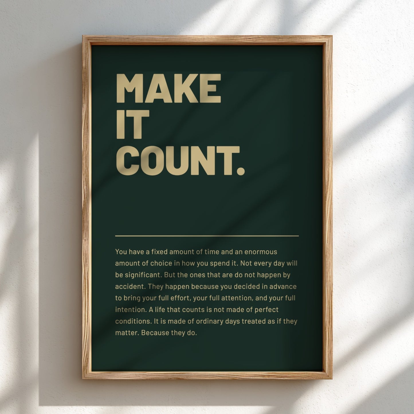 Framed poster with motivational quote 'MAKE IT COUNT.' on a dark green background.