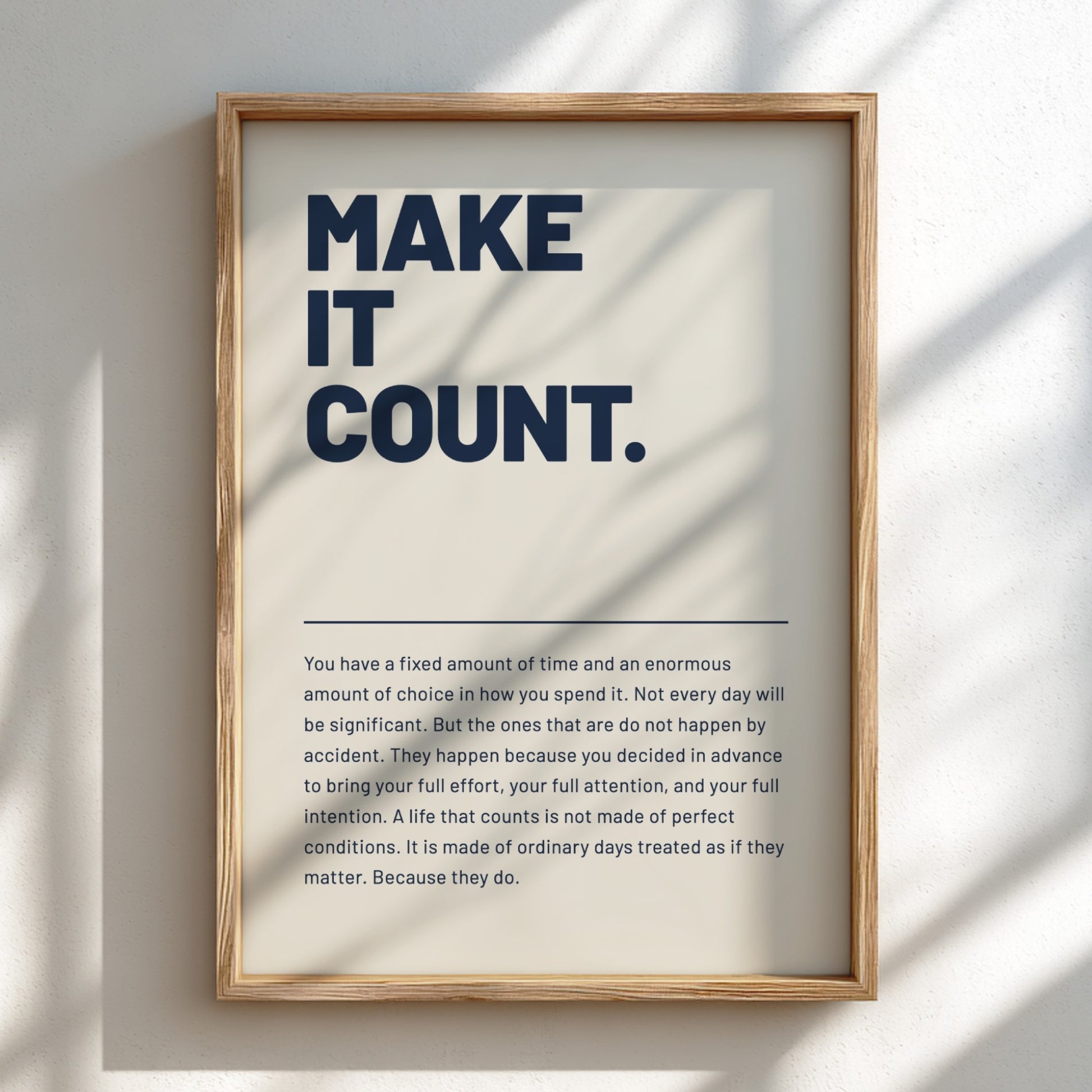 Framed print with motivational quote 'MAKE IT COUNT.' on a light background