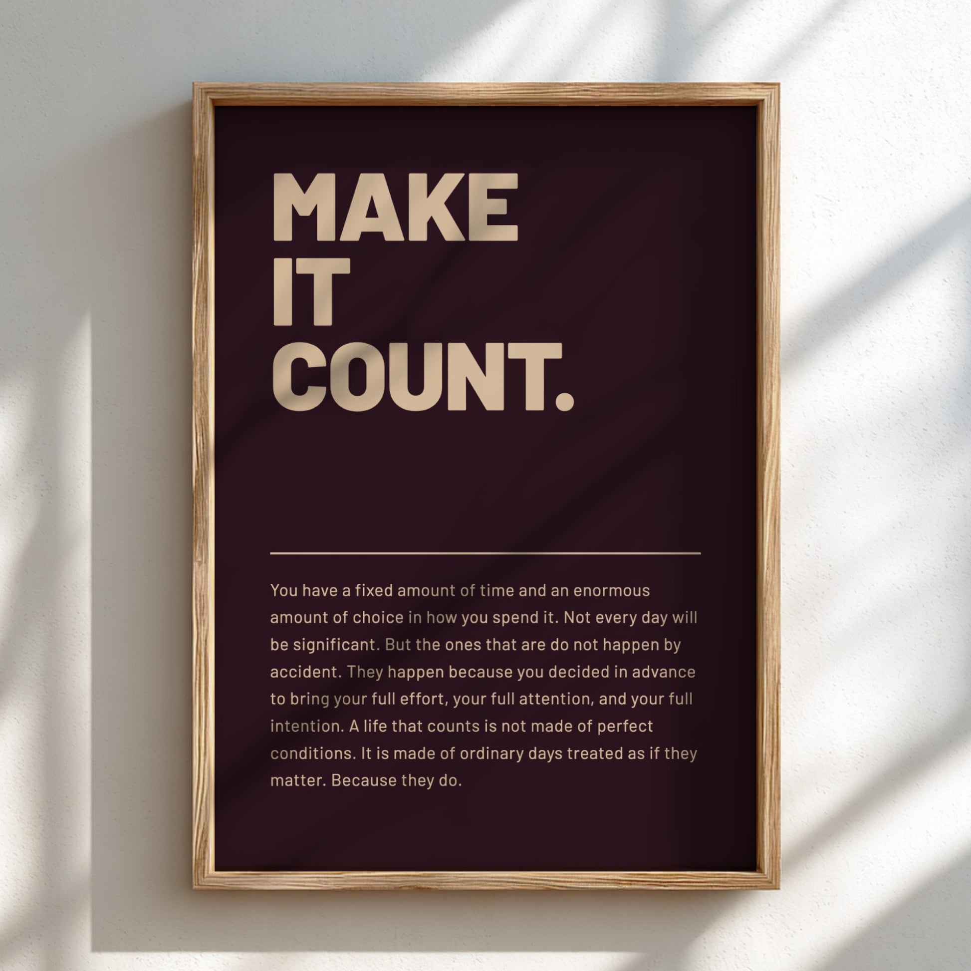 Framed poster with motivational quote 'MAKE IT COUNT.' on a dark background