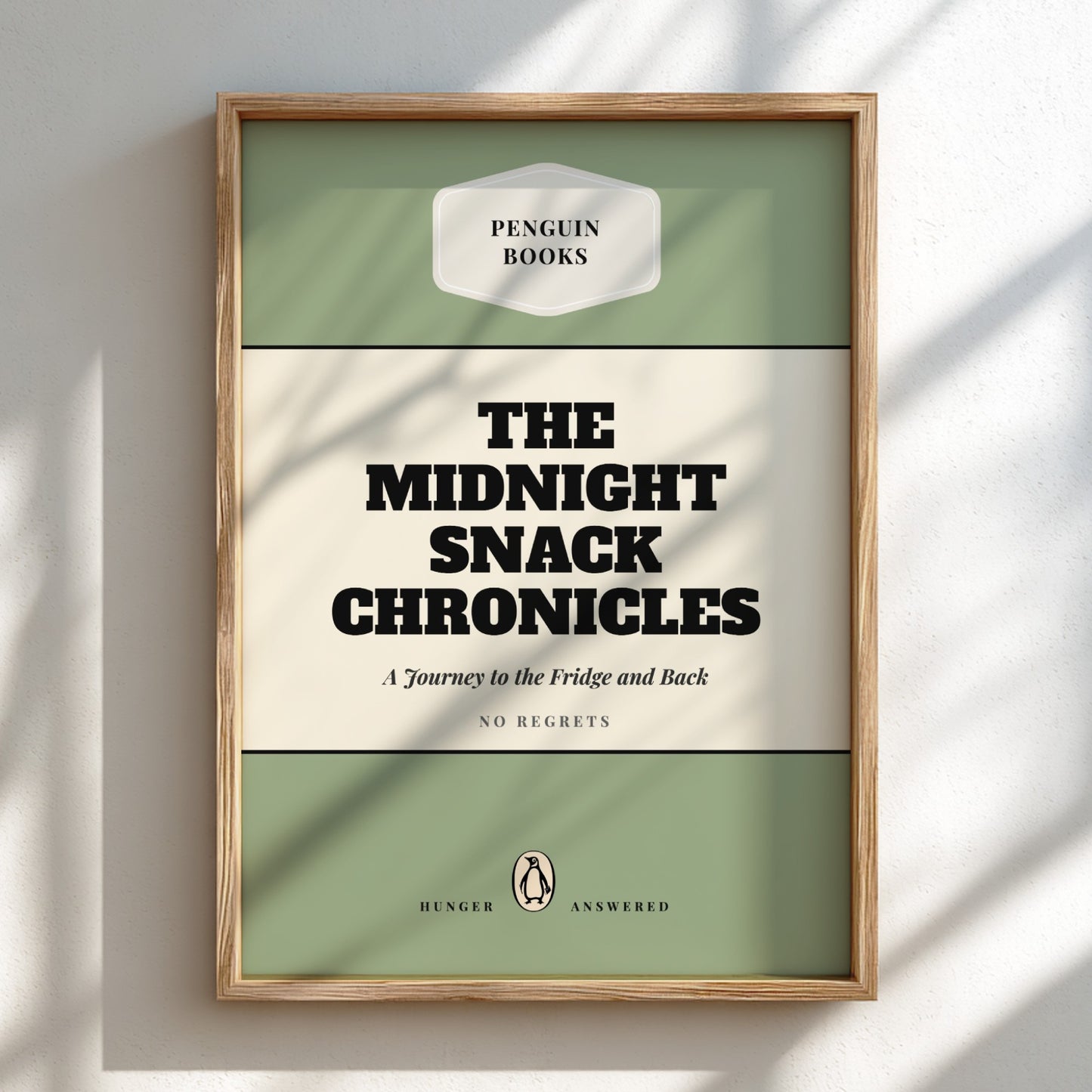 Framed book cover of 'The Midnight Snack Chronicles' by Penguin Books on a light background