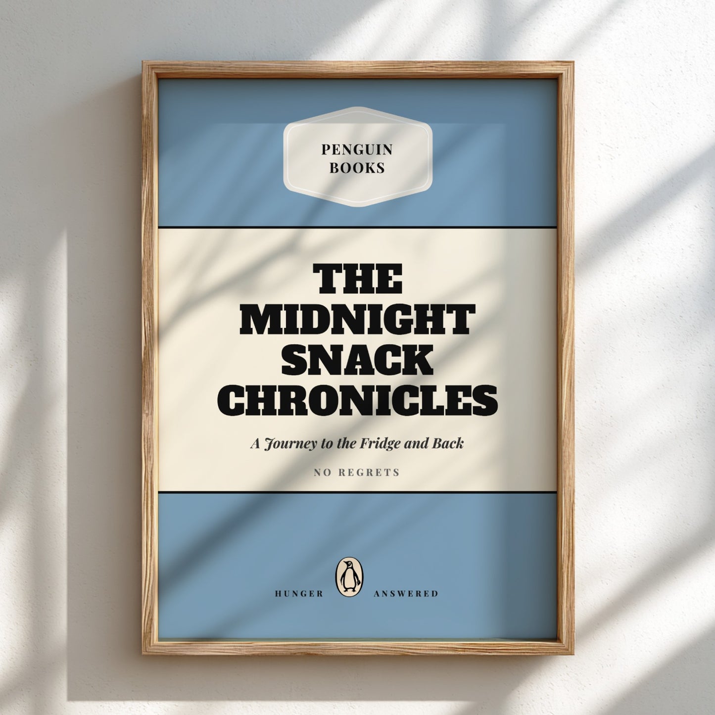 Framed book cover of 'The Midnight Snack Chronicles' by Penguin Books on a light background