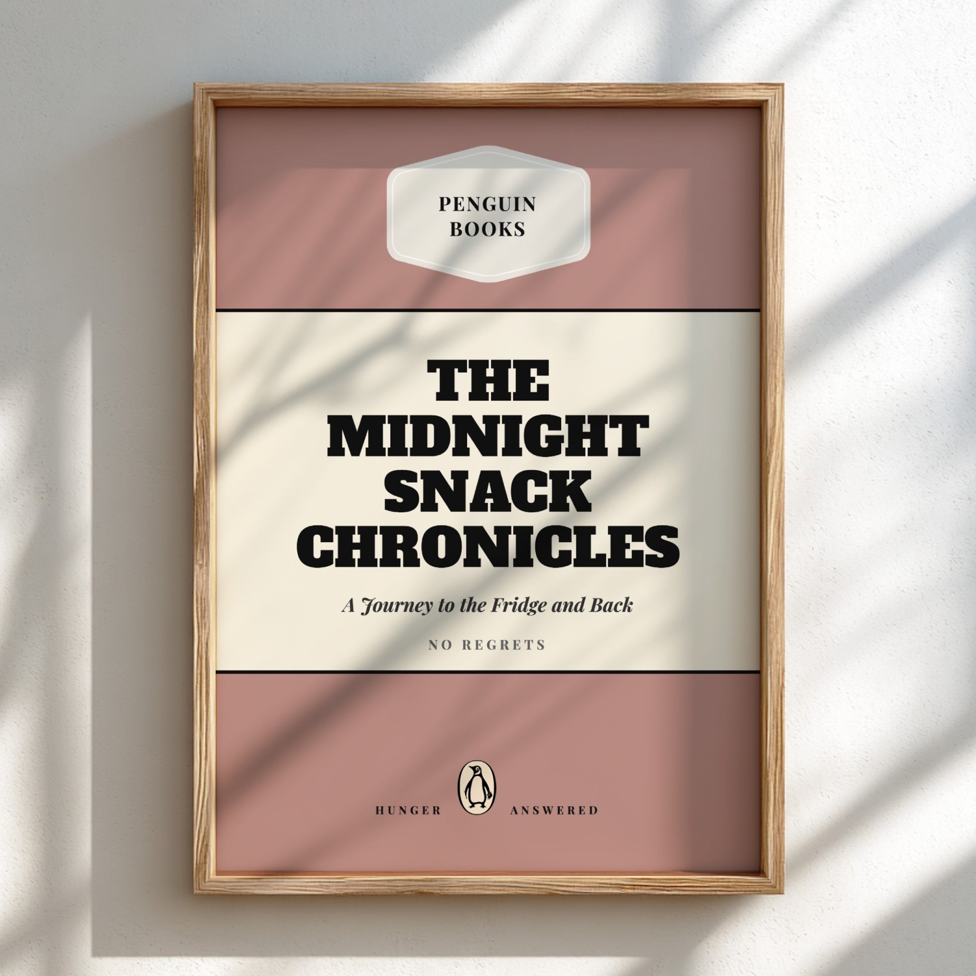 Framed book cover of 'The Midnight Snack Chronicles' by Penguin Books on a light background