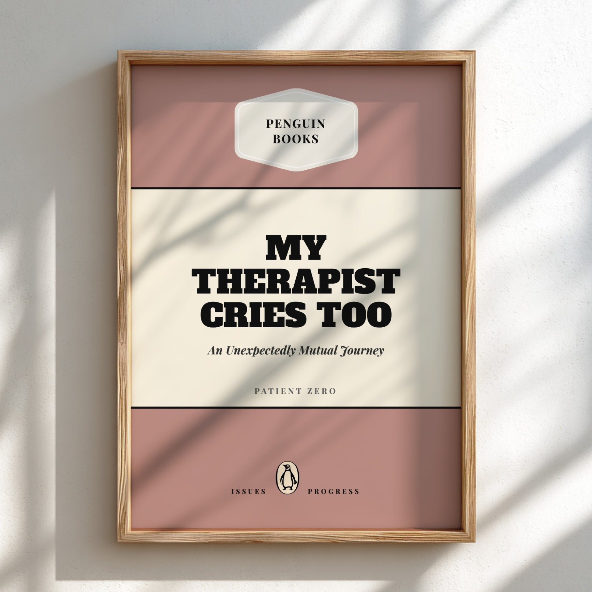 Framed book titled 'My Therapist Cries Too' by Penguin Books on a light background