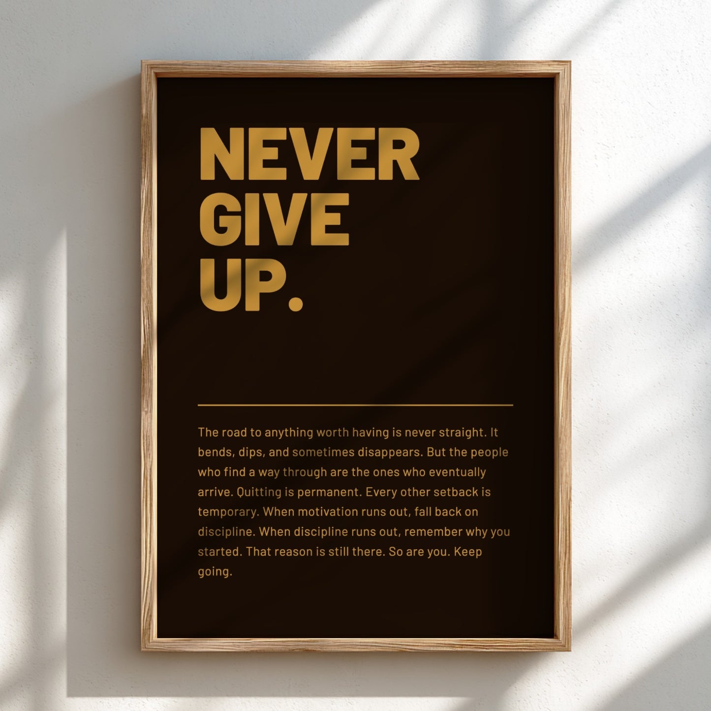 Framed poster with 'Never Give Up.' text on a dark background
