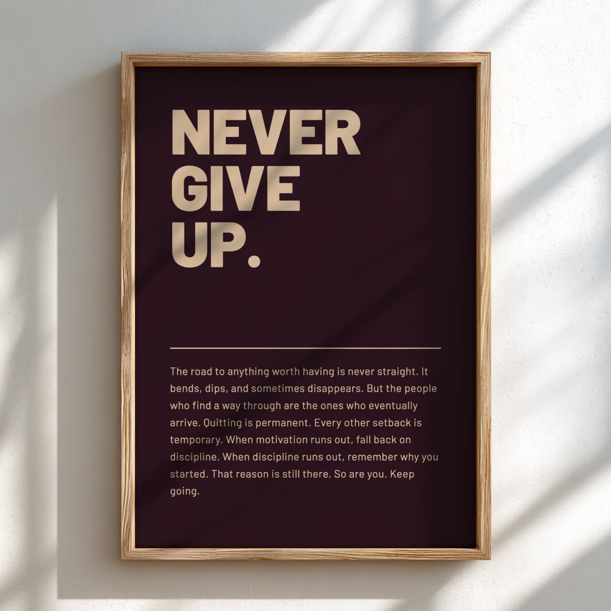 Framed motivational poster with 'Never Give Up.' text on a dark background