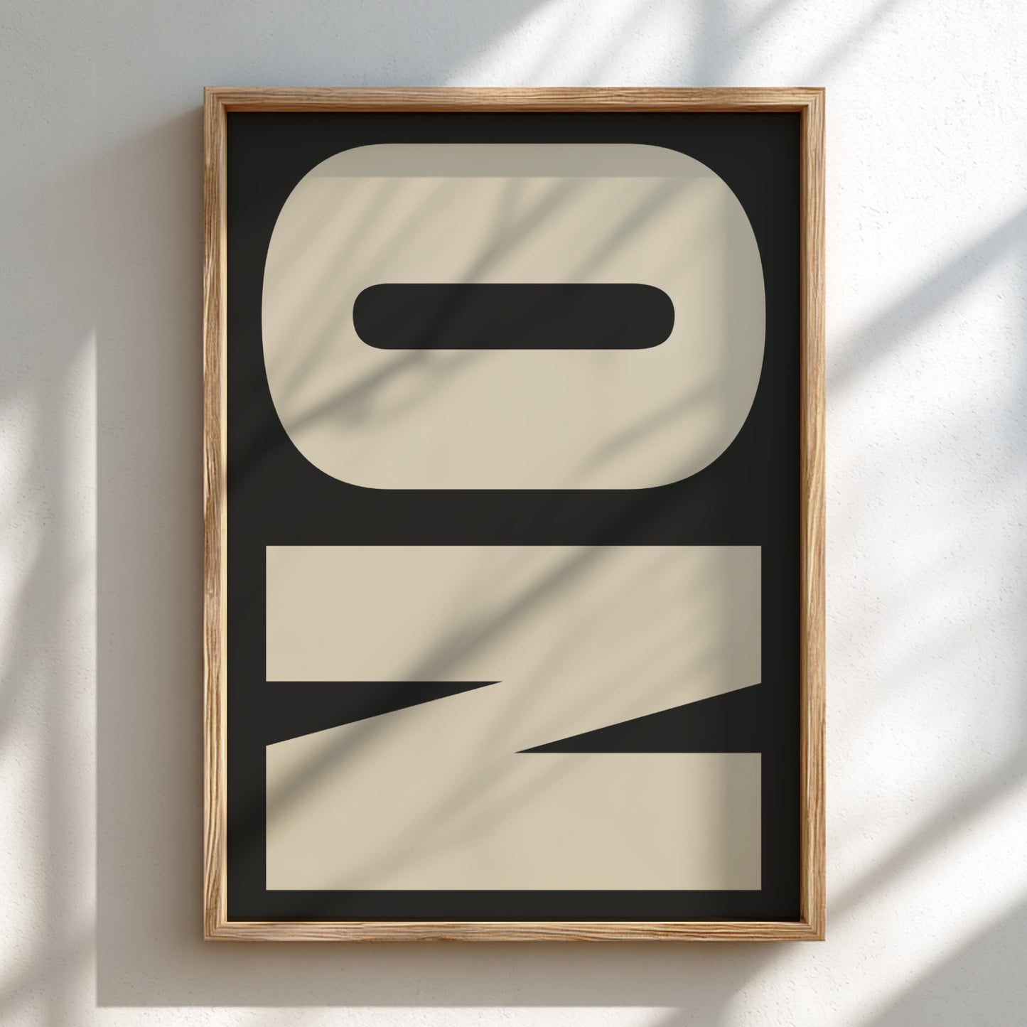 Framed abstract art piece with geometric shapes on a light background