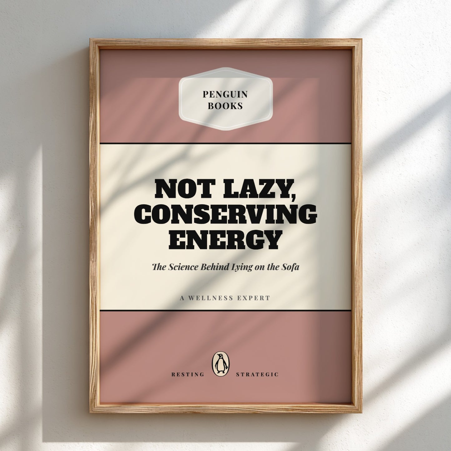 Framed book cover with 'Penguin Books' branding and text about energy conservation.
