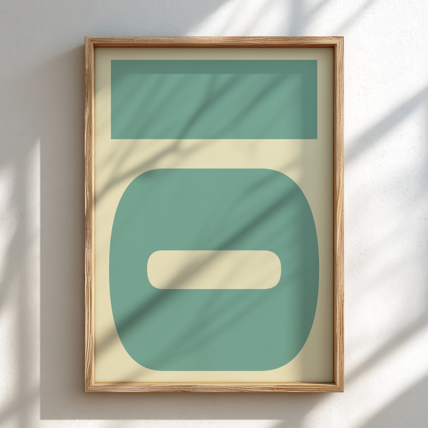 Framed abstract art with geometric shapes on a light background