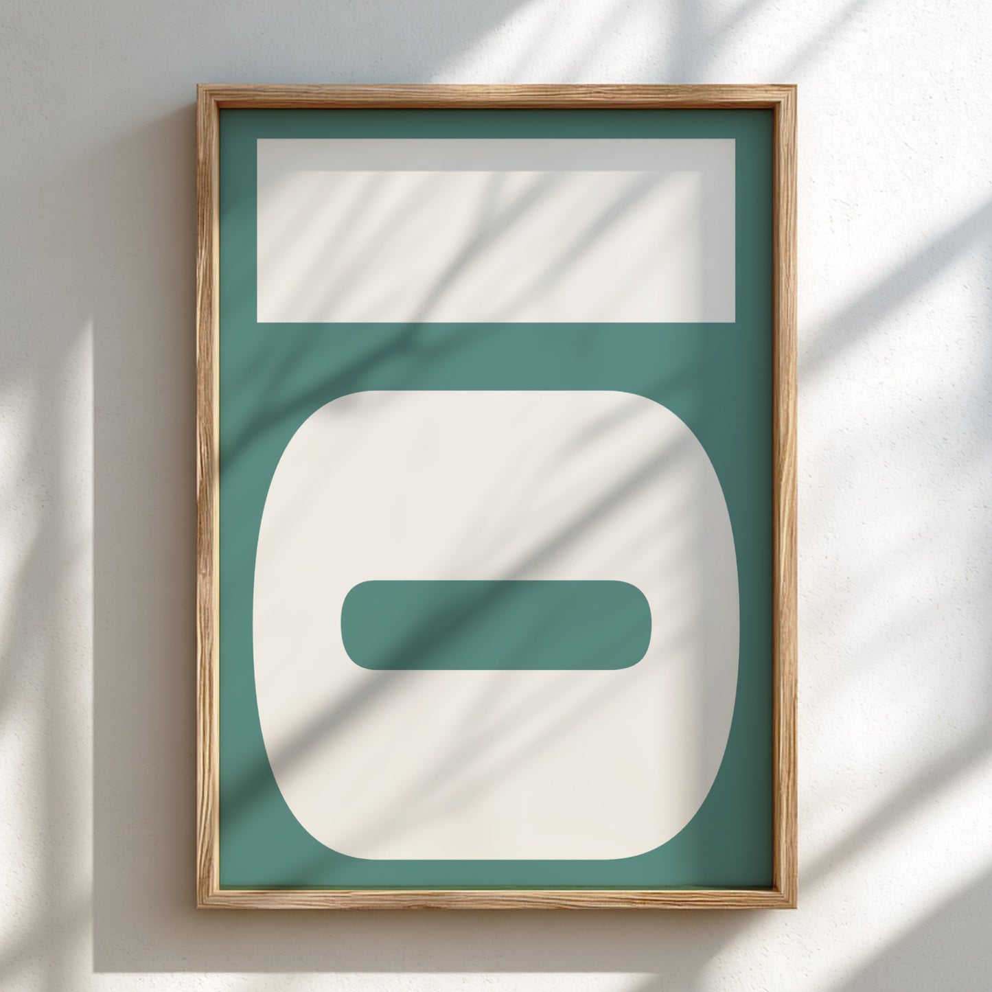 Framed abstract art piece with geometric shapes on a teal background