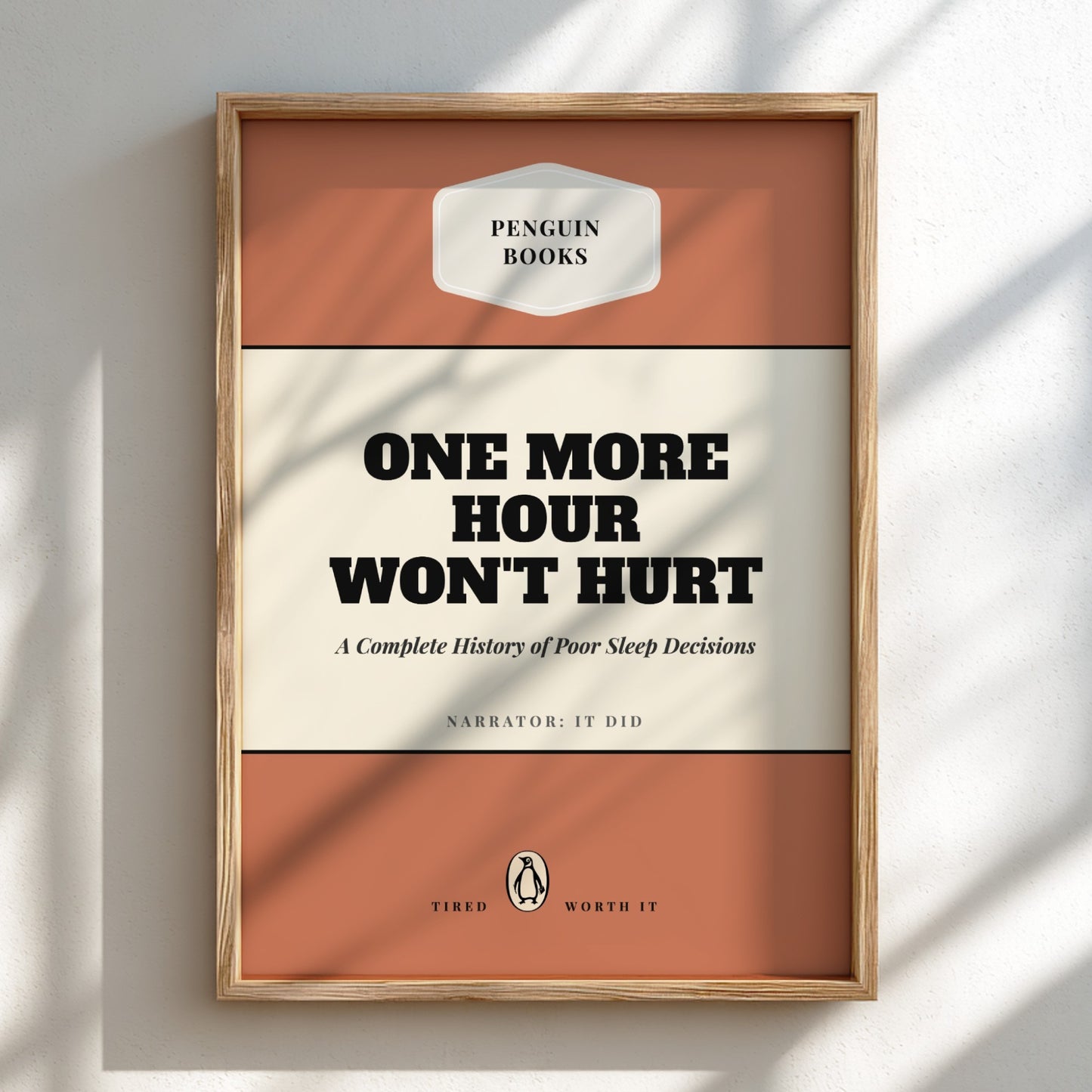 Framed book cover with 'Penguin Books' branding and text on a light background