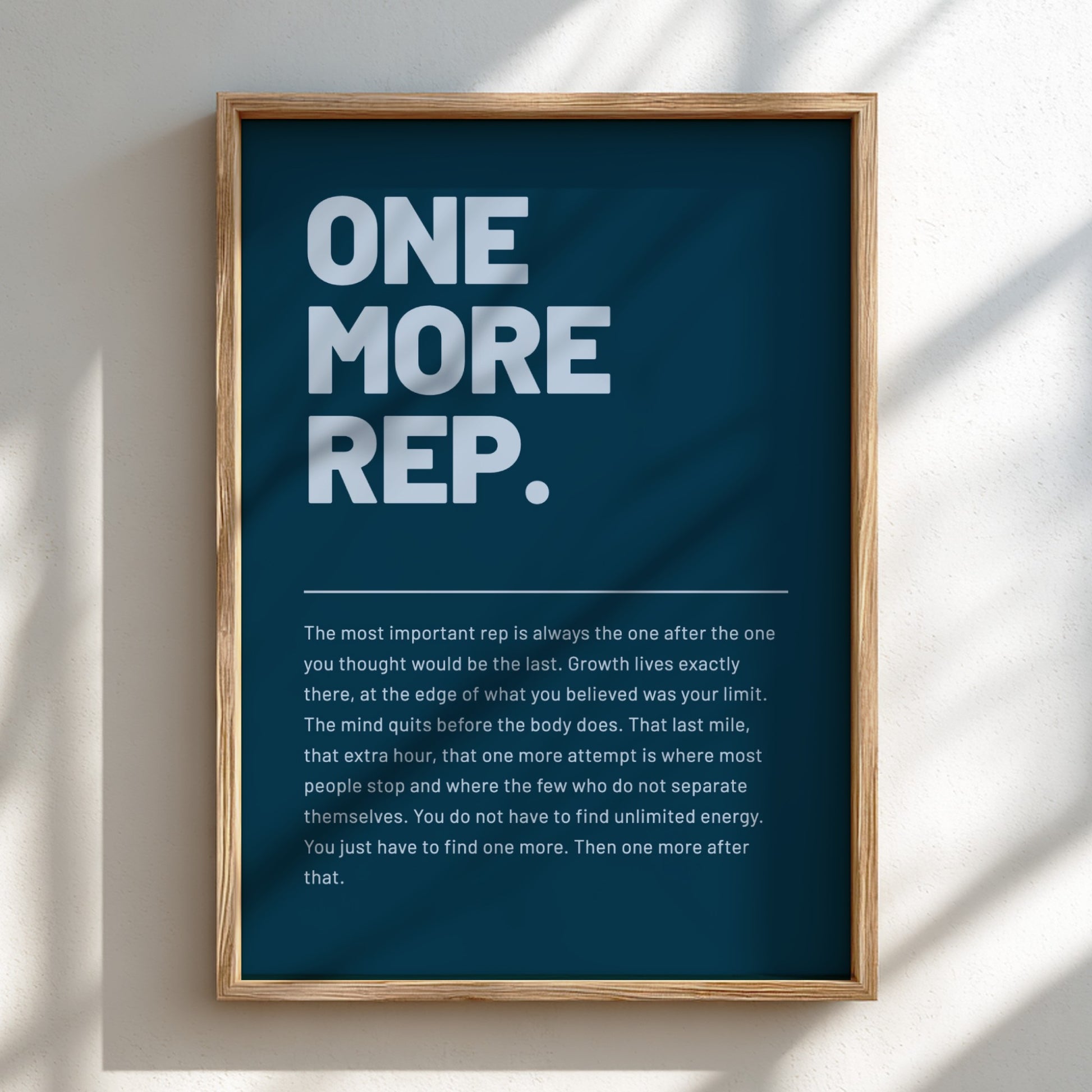 Framed poster with motivational quote on a blue background