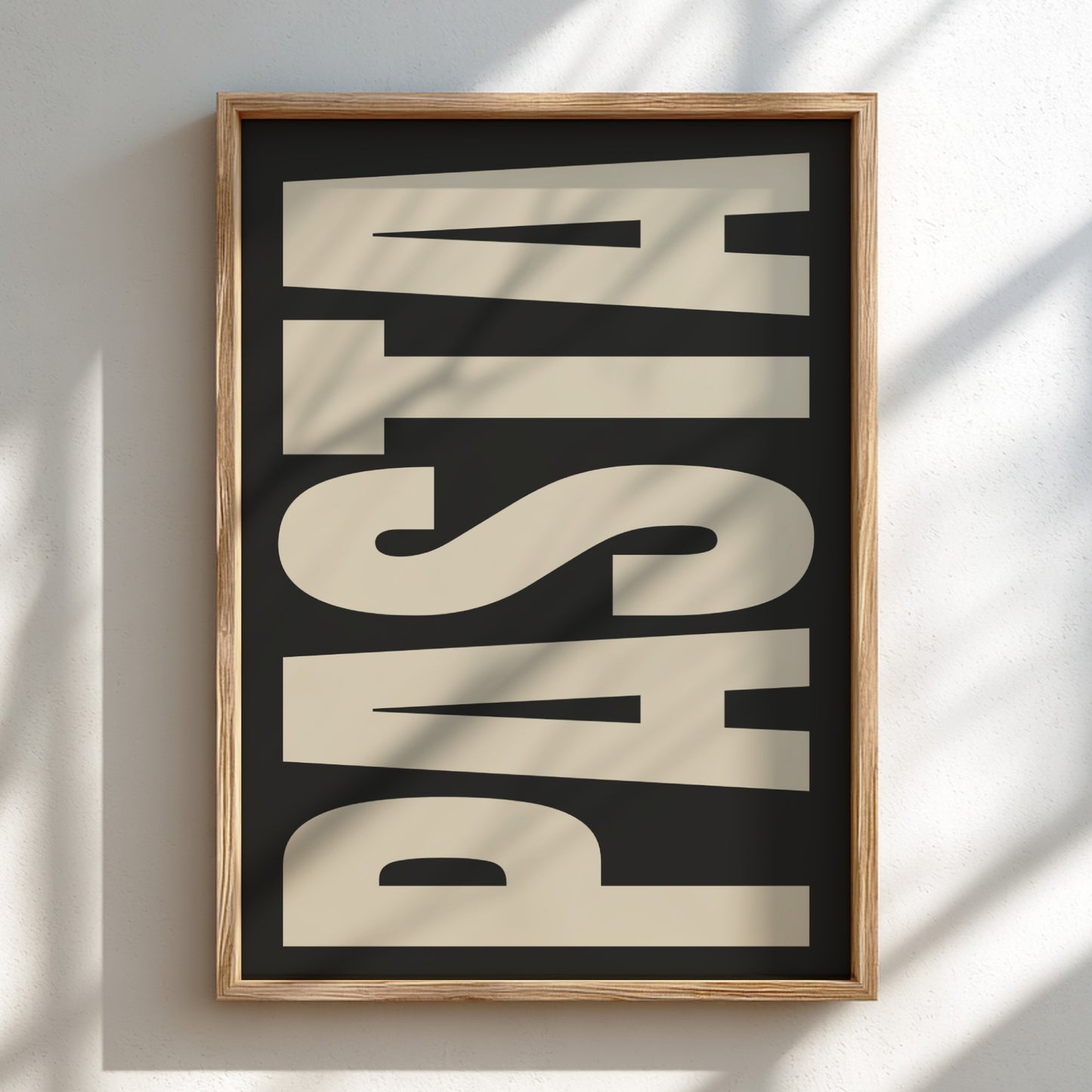Framed artwork with the word 'PASTA' on a black background