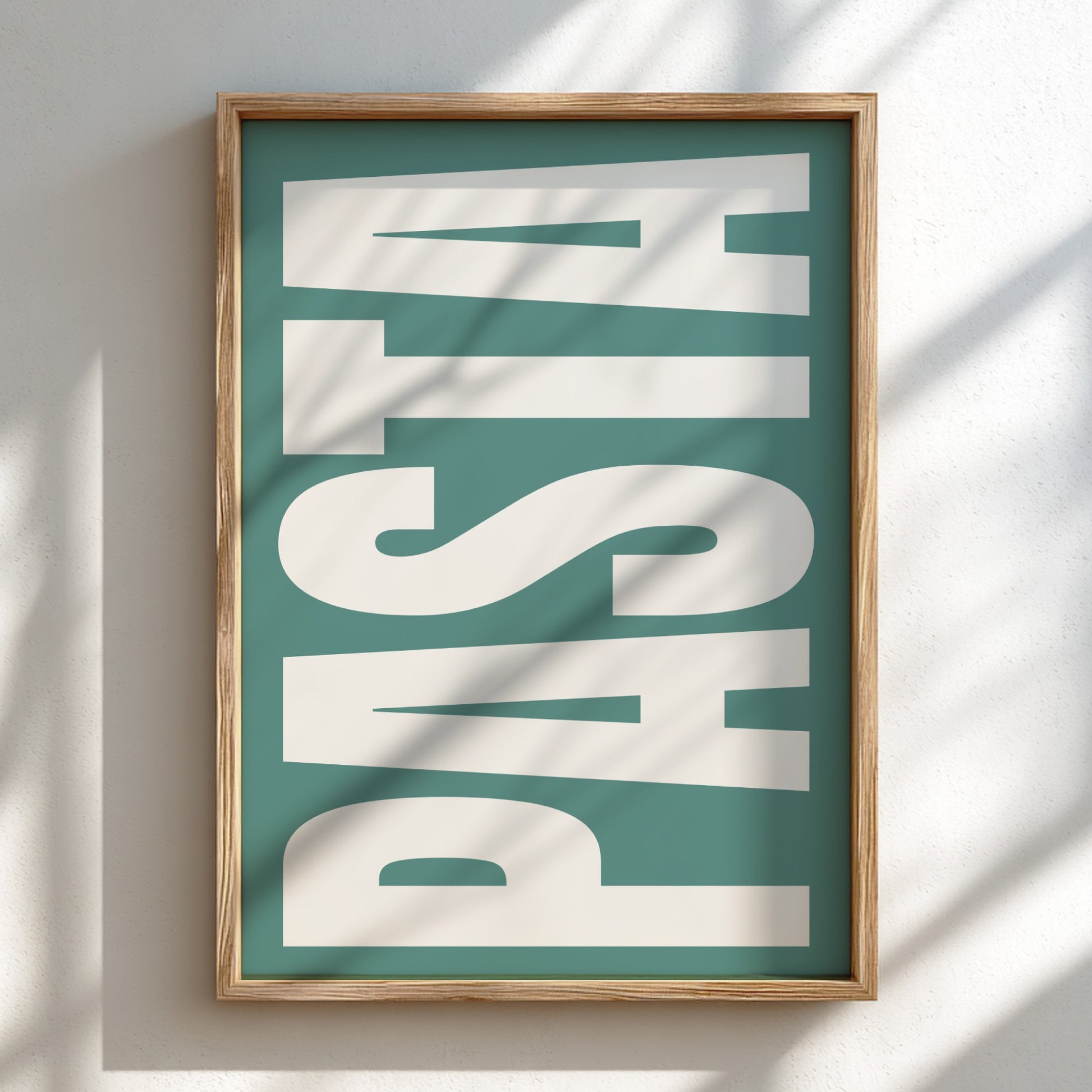 Framed artwork with the word 'PASTA' on a teal background