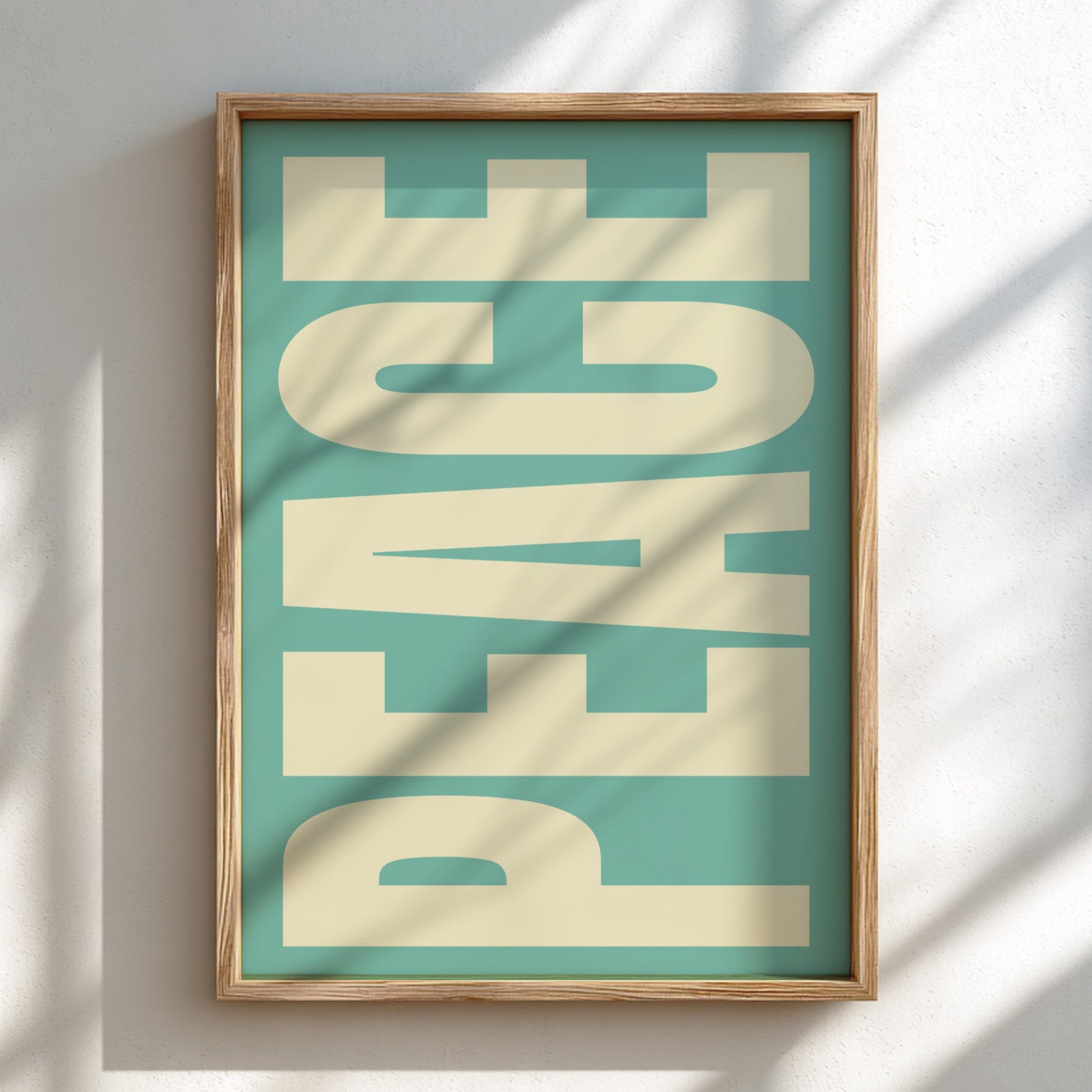 Framed artwork with 'PEACE' text on a teal background