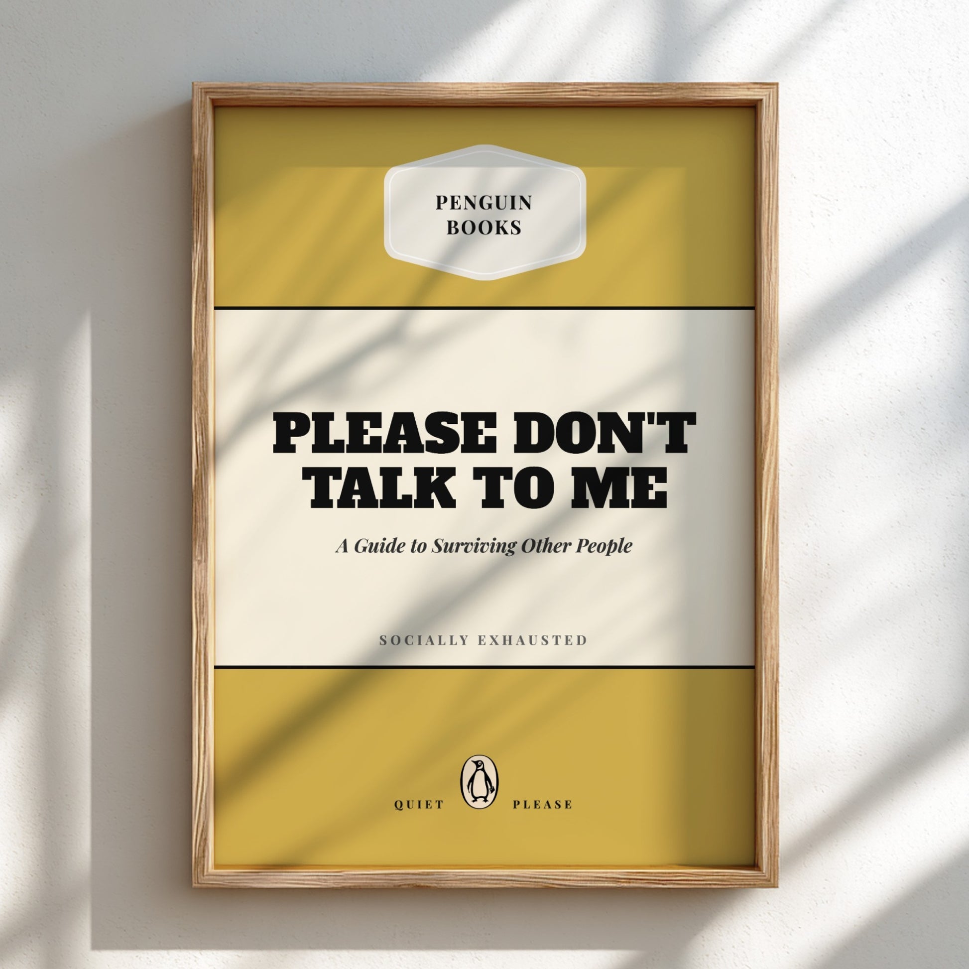 Framed book cover with 'Please Don't Talk to Me' text on a light background