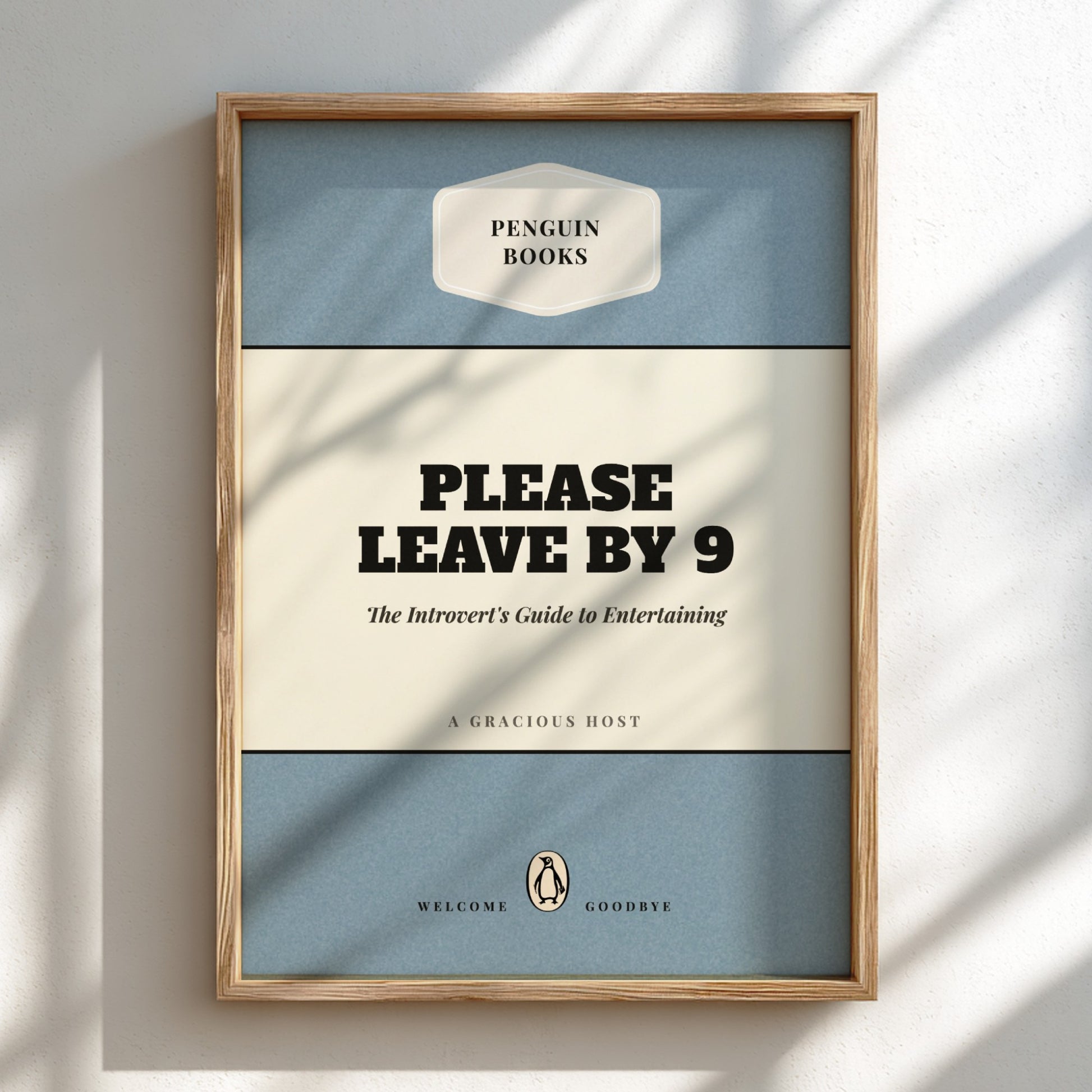 Framed Penguin Books poster with text 'Please Leave by 9' on a light background