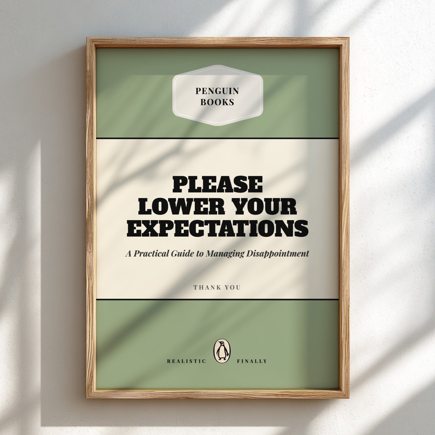Framed book cover with 'Penguin Books' logo and humorous text on a light background