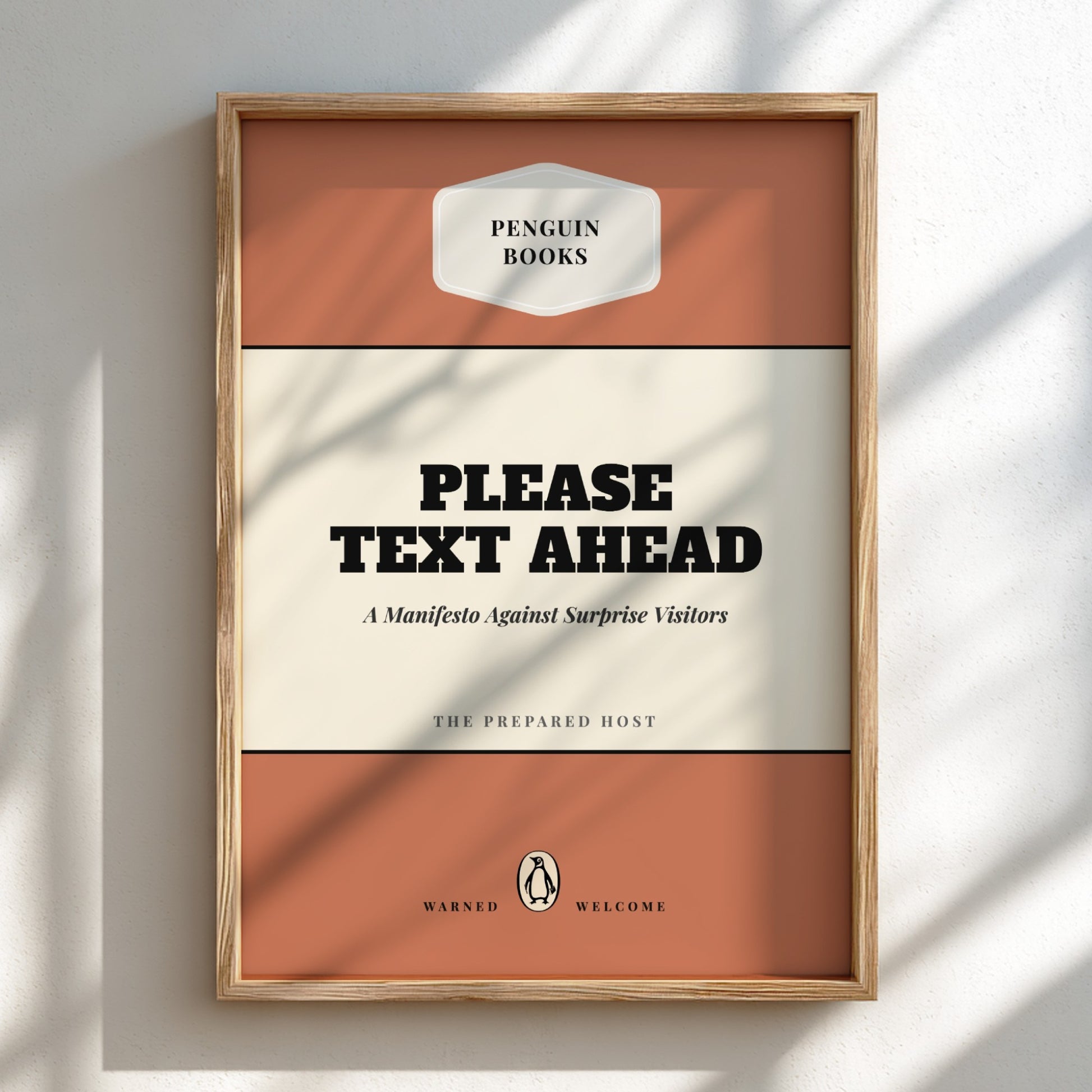 Framed book cover with 'Penguin Books' logo and text 'Please Text Ahead' on a light background