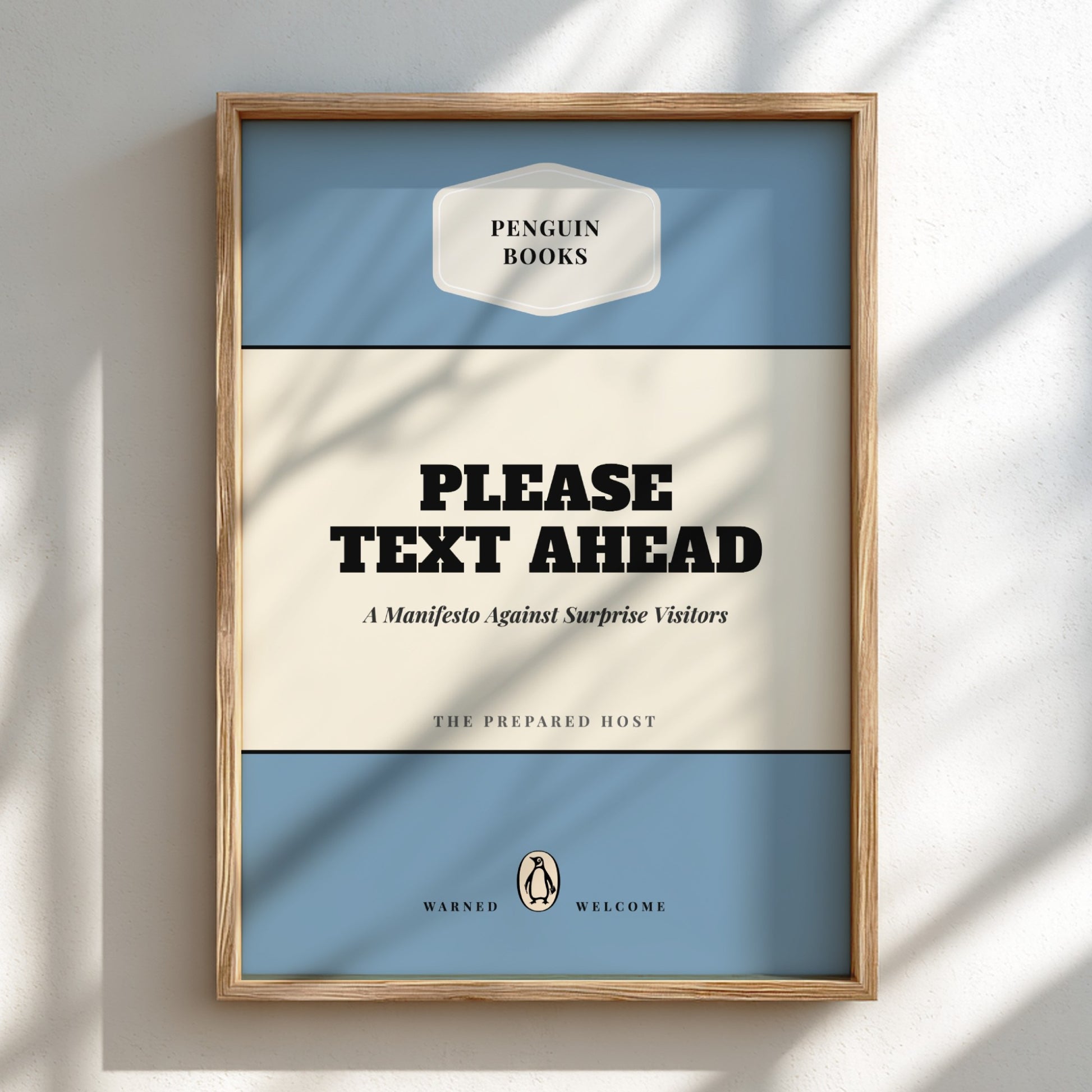 Framed poster with 'Penguin Books' design and text 'Please Text Ahead' on a light background.