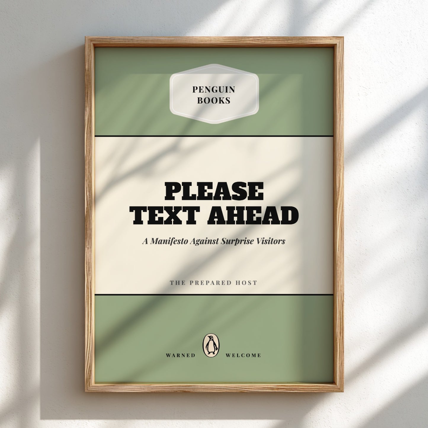 Framed book cover with text 'Please Text Ahead' on a light background