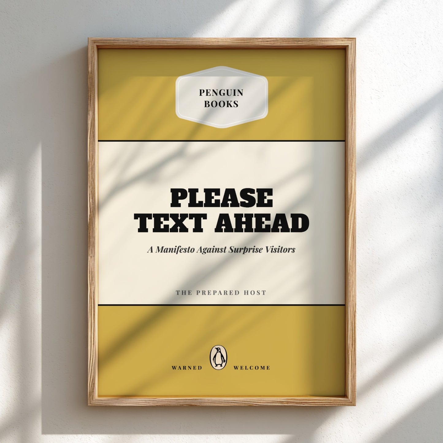 Framed book cover with 'Penguin Books' logo and text 'Please Text Ahead' on a light background