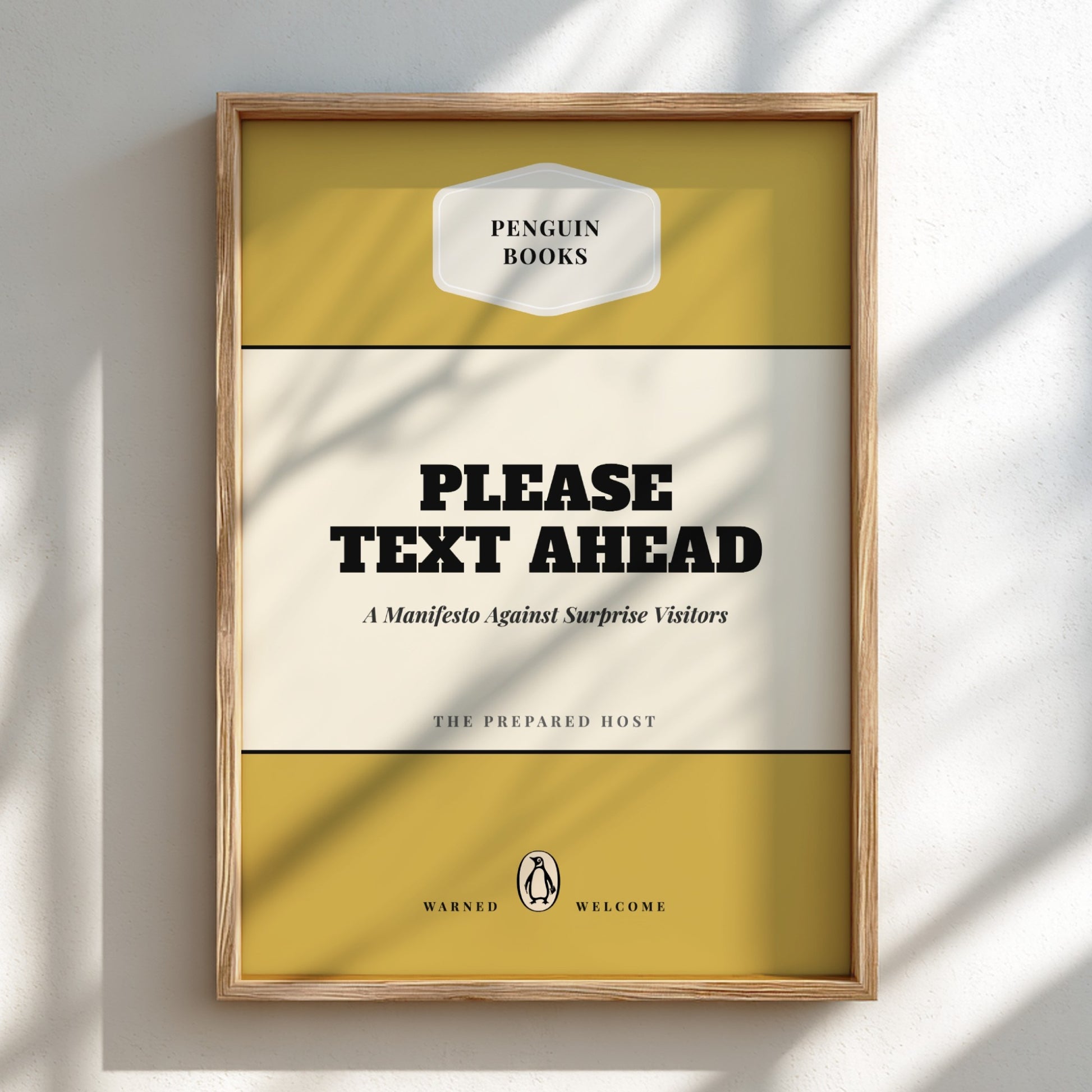 Framed book cover with 'Penguin Books' logo and text 'Please Text Ahead' on a light background