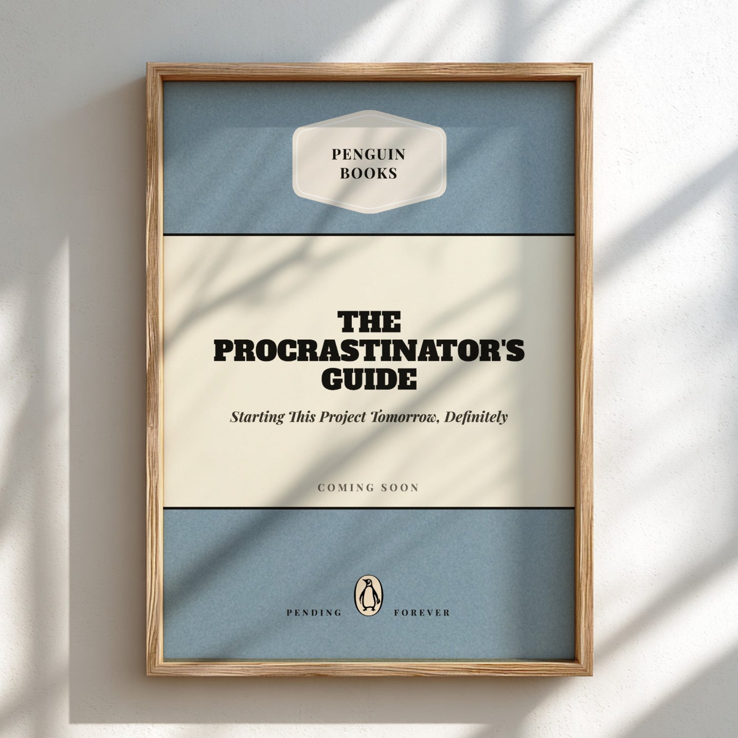 Framed poster of 'The Procrastinator's Guide' by Penguin Books on a light background