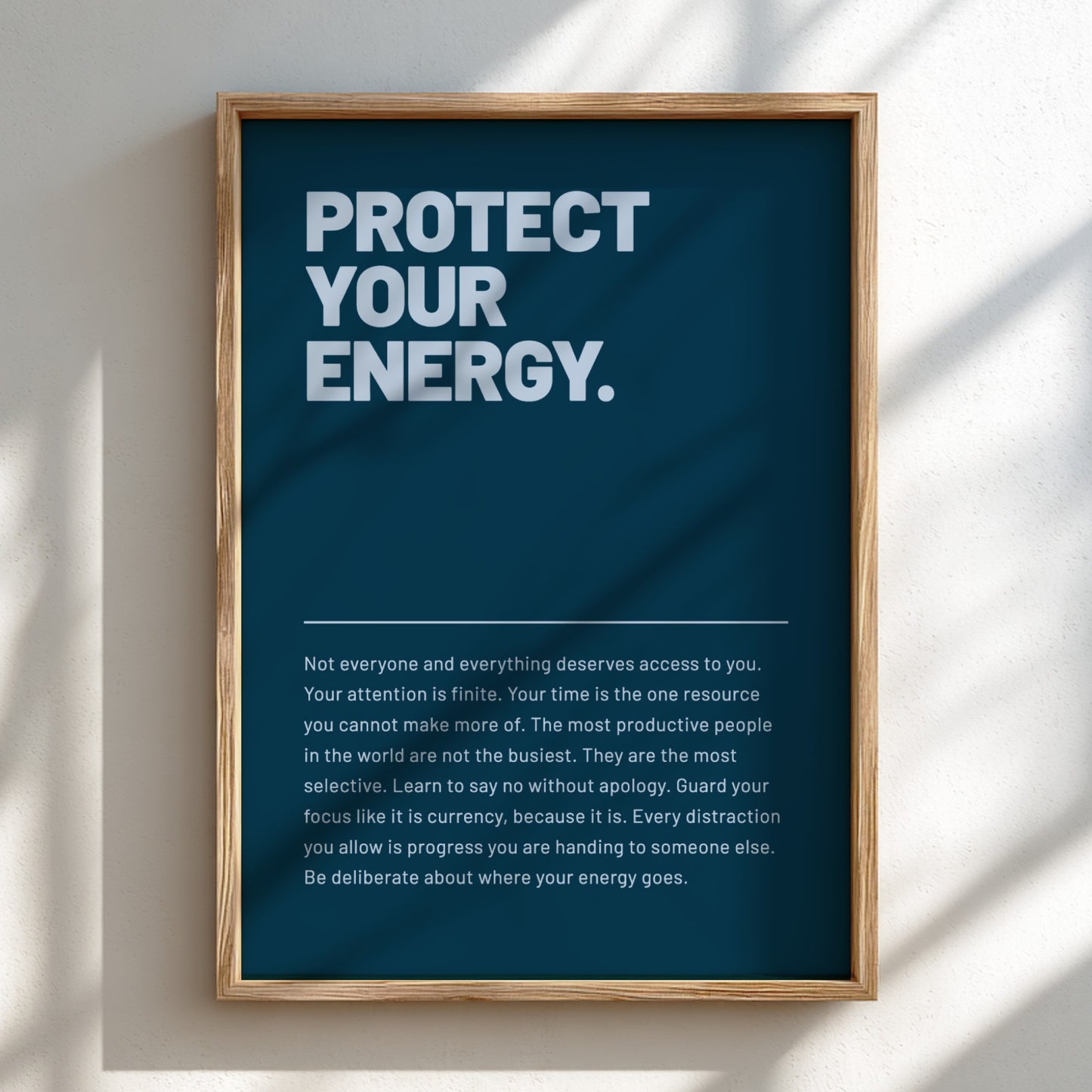 Framed poster with motivational text on a wall