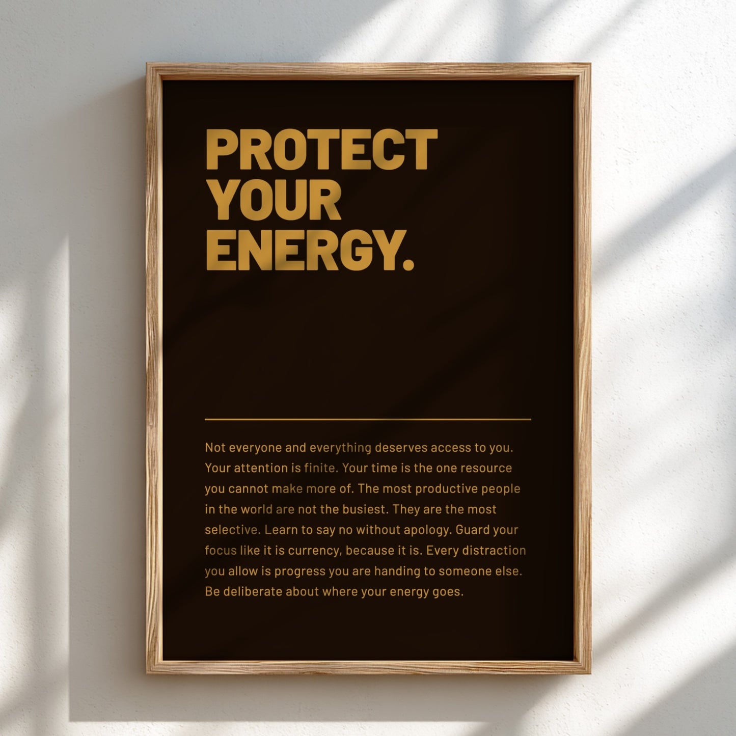 Framed poster with motivational quote on a wall