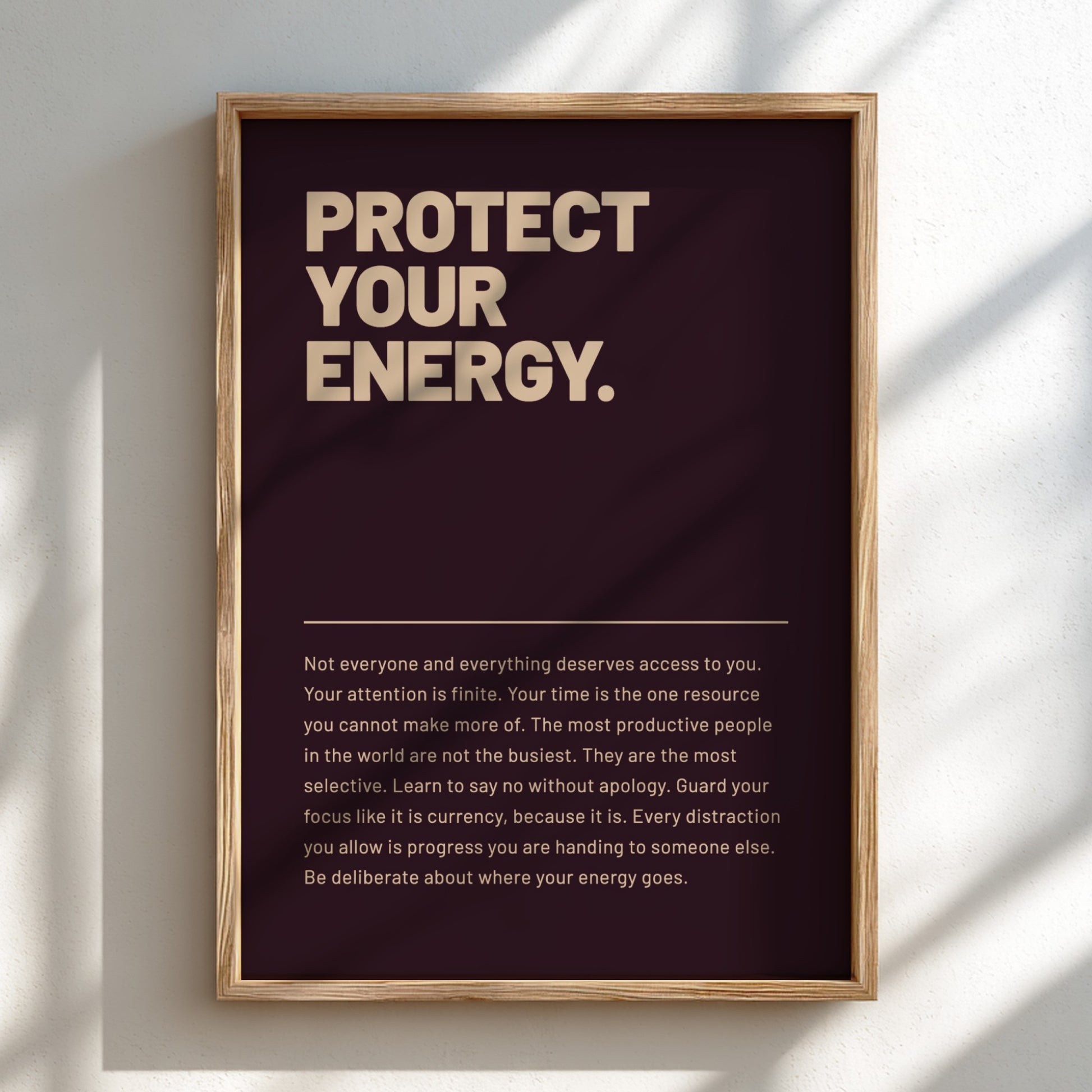Framed poster with motivational text on a wall