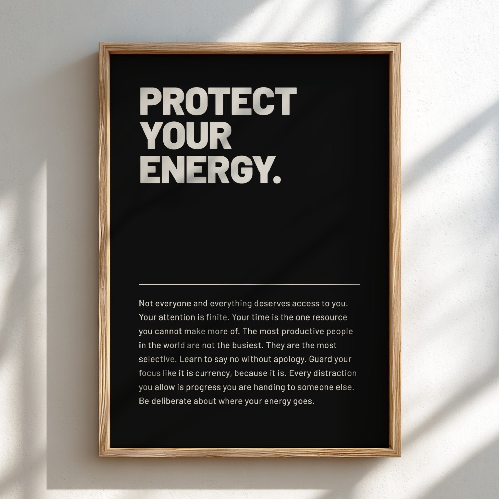 Framed poster with motivational quote 'Protect Your Energy' on a black background