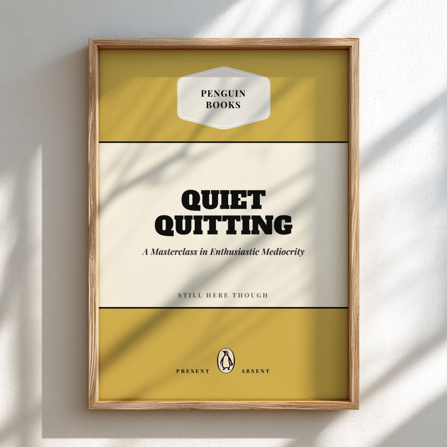 Framed book cover of 'Quiet Quitting' by Penguin Books on a light background