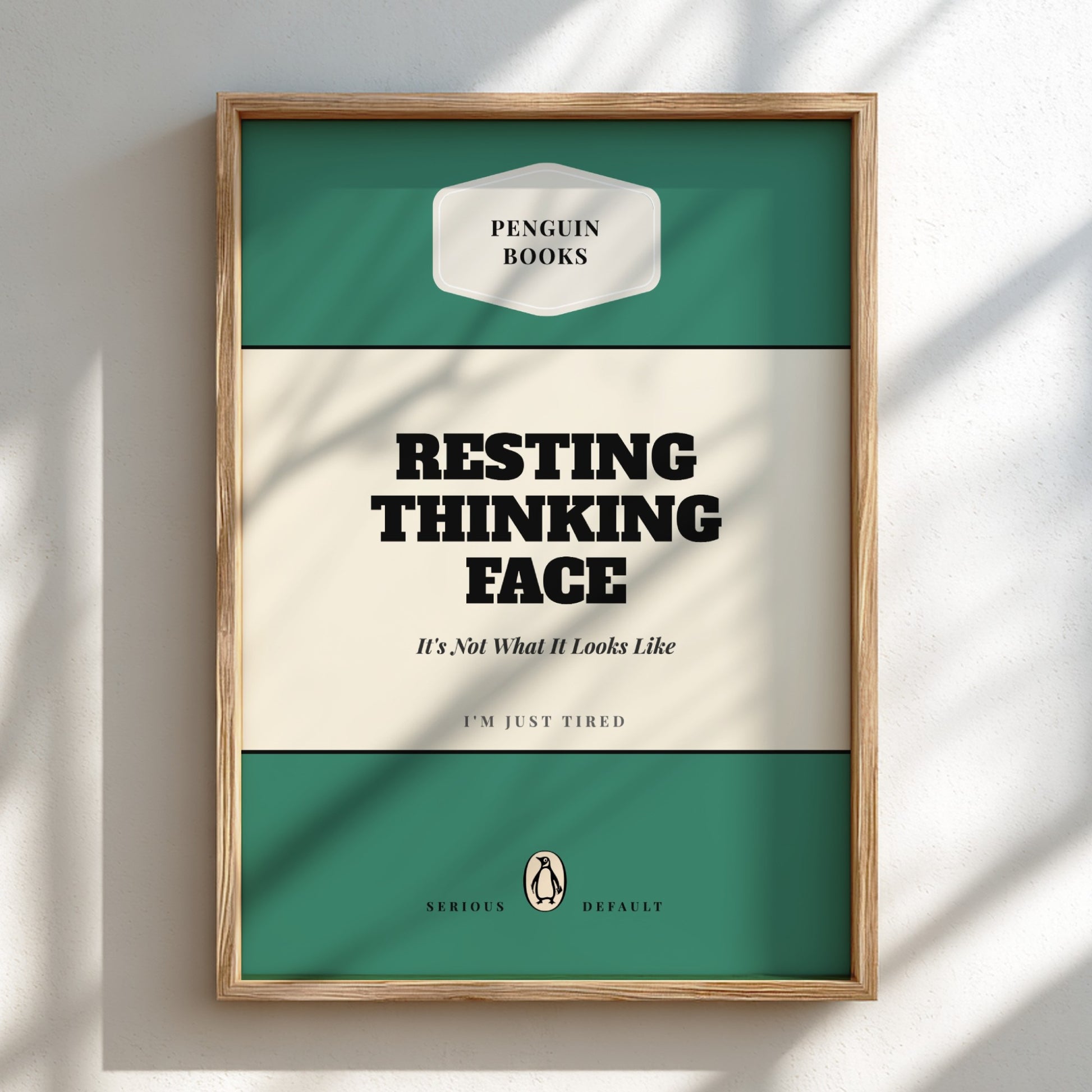 Framed poster with 'Penguin Books' design and text 'Resting Thinking Face'.