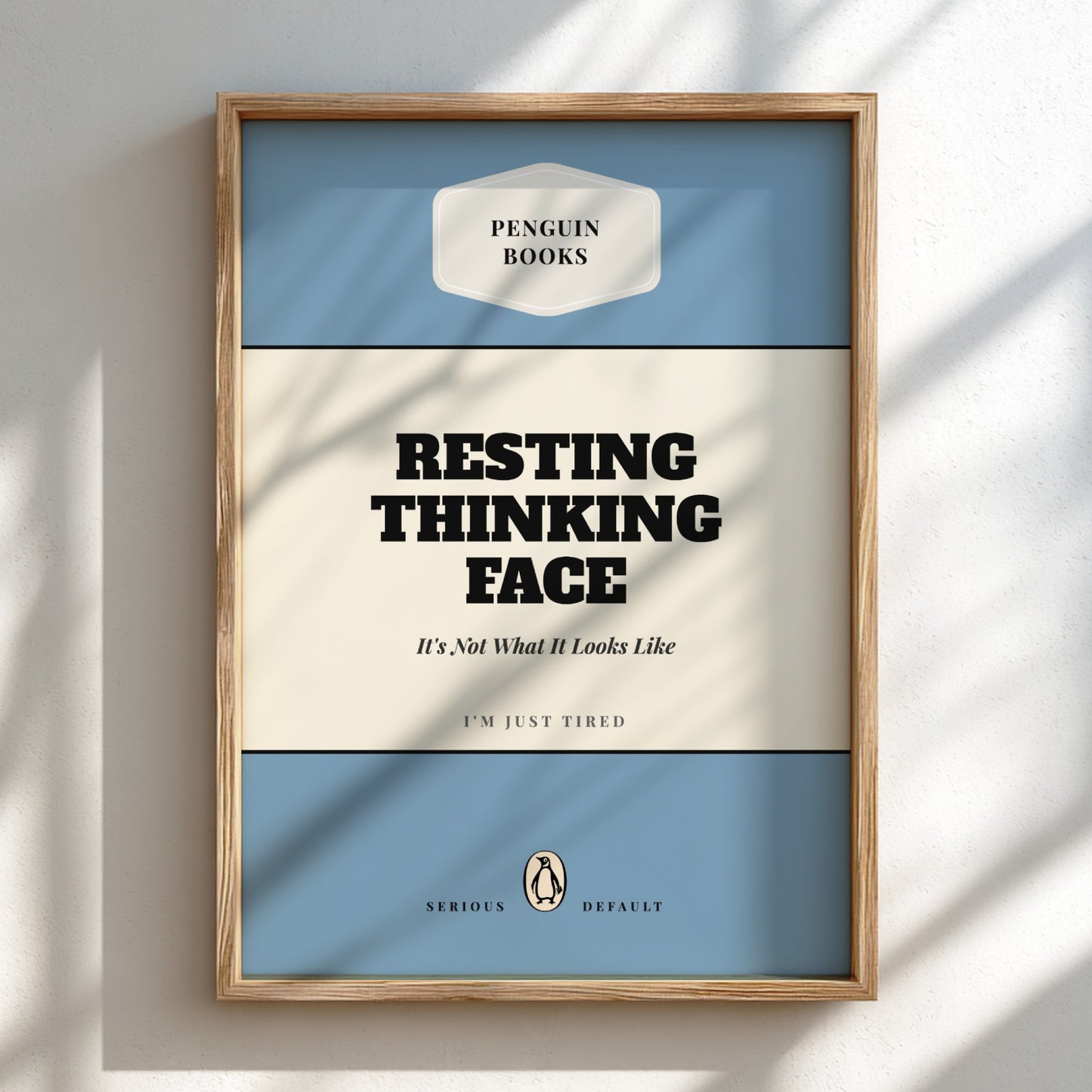Framed poster with 'Penguin Books' design and text 'Resting Thinking Face'.