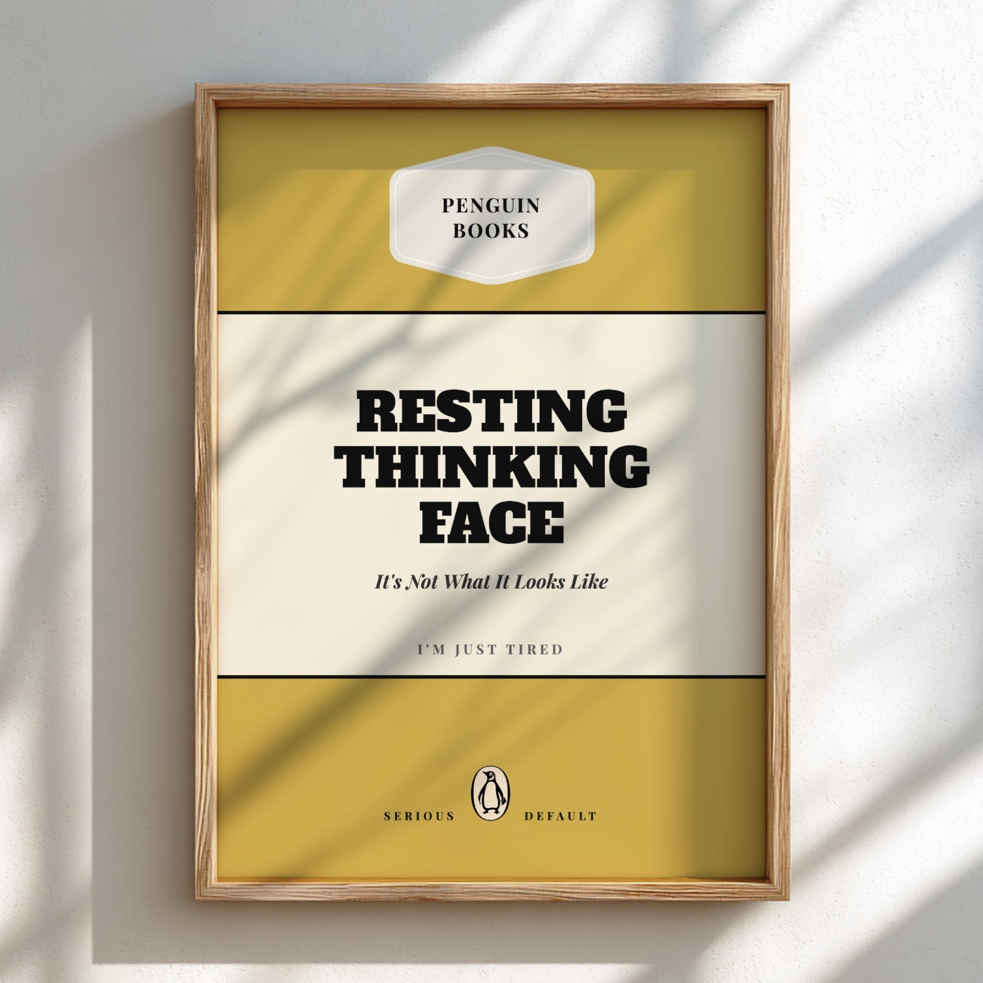 Framed poster with 'Penguin Books' design and text 'Resting Thinking Face'.