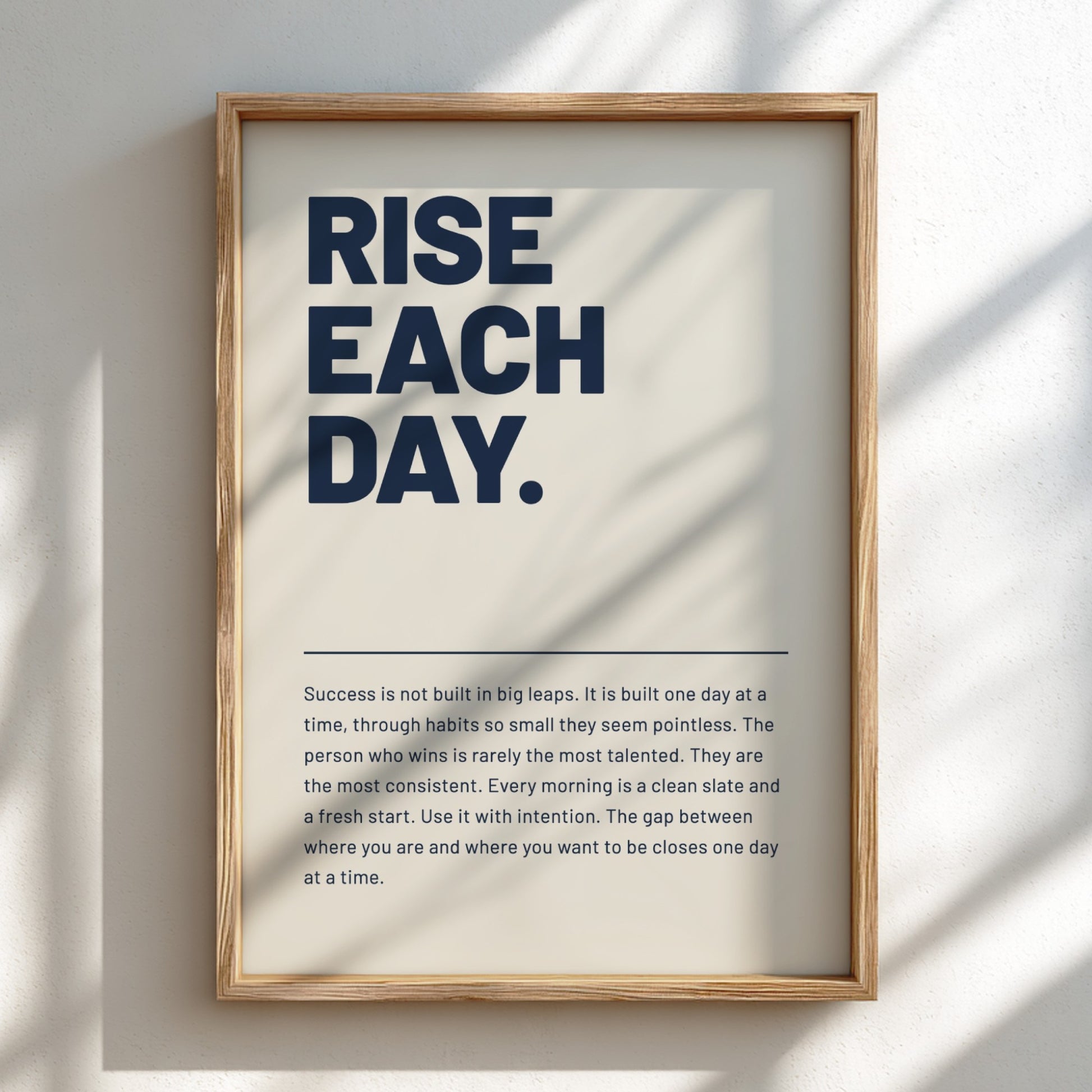 Framed motivational poster with text on a light background