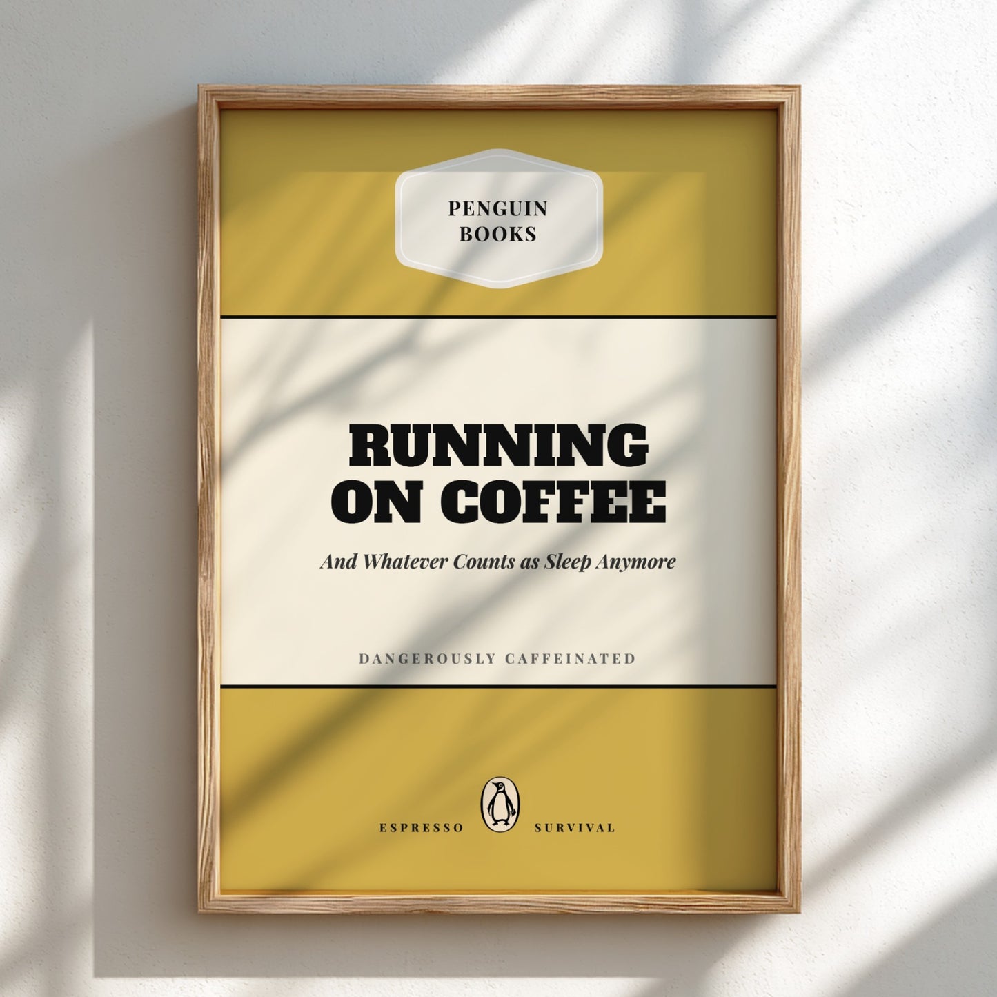 Framed book cover of 'Running on Coffee' by Penguin Books on a light background