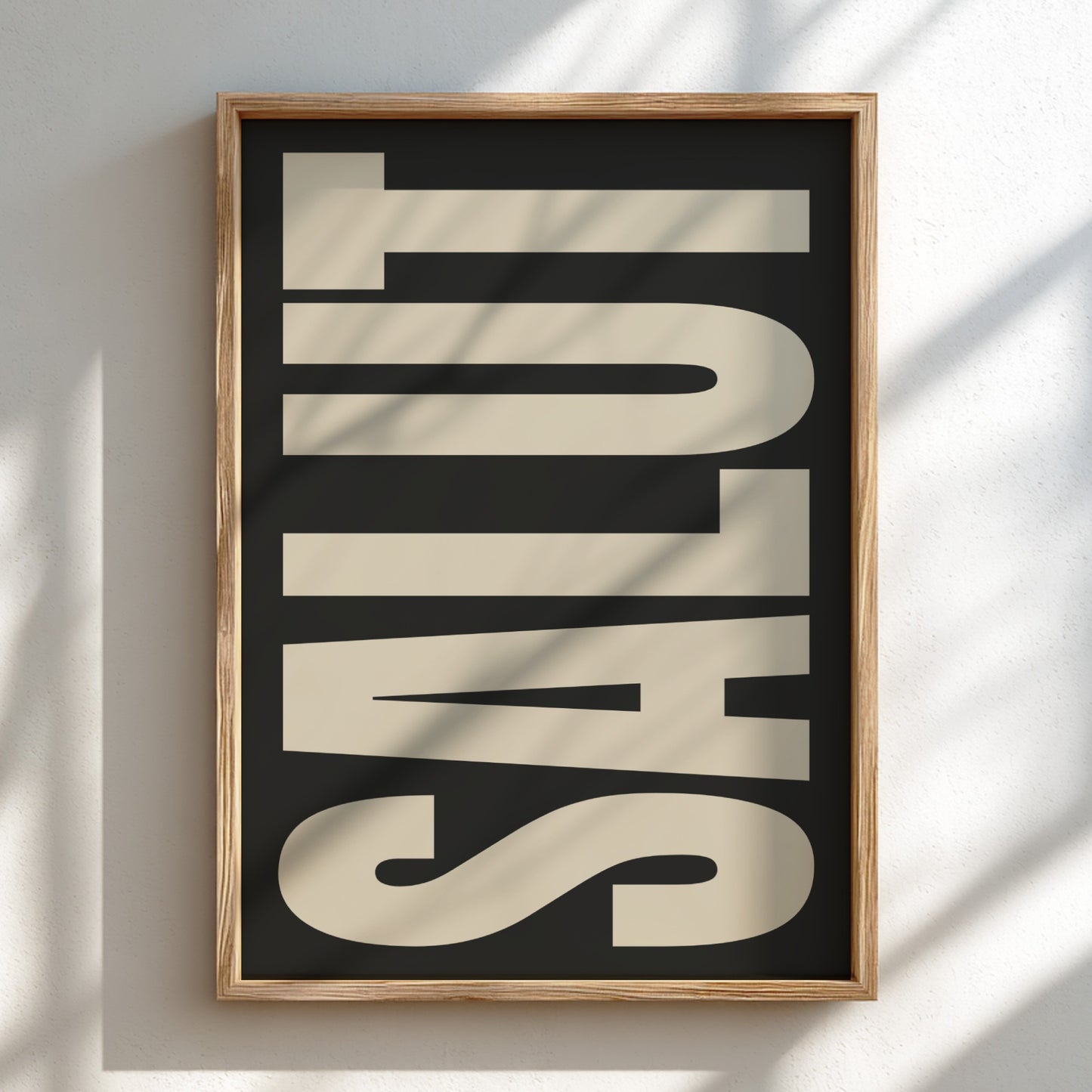 Framed artwork with the word 'SALUT' on a black background