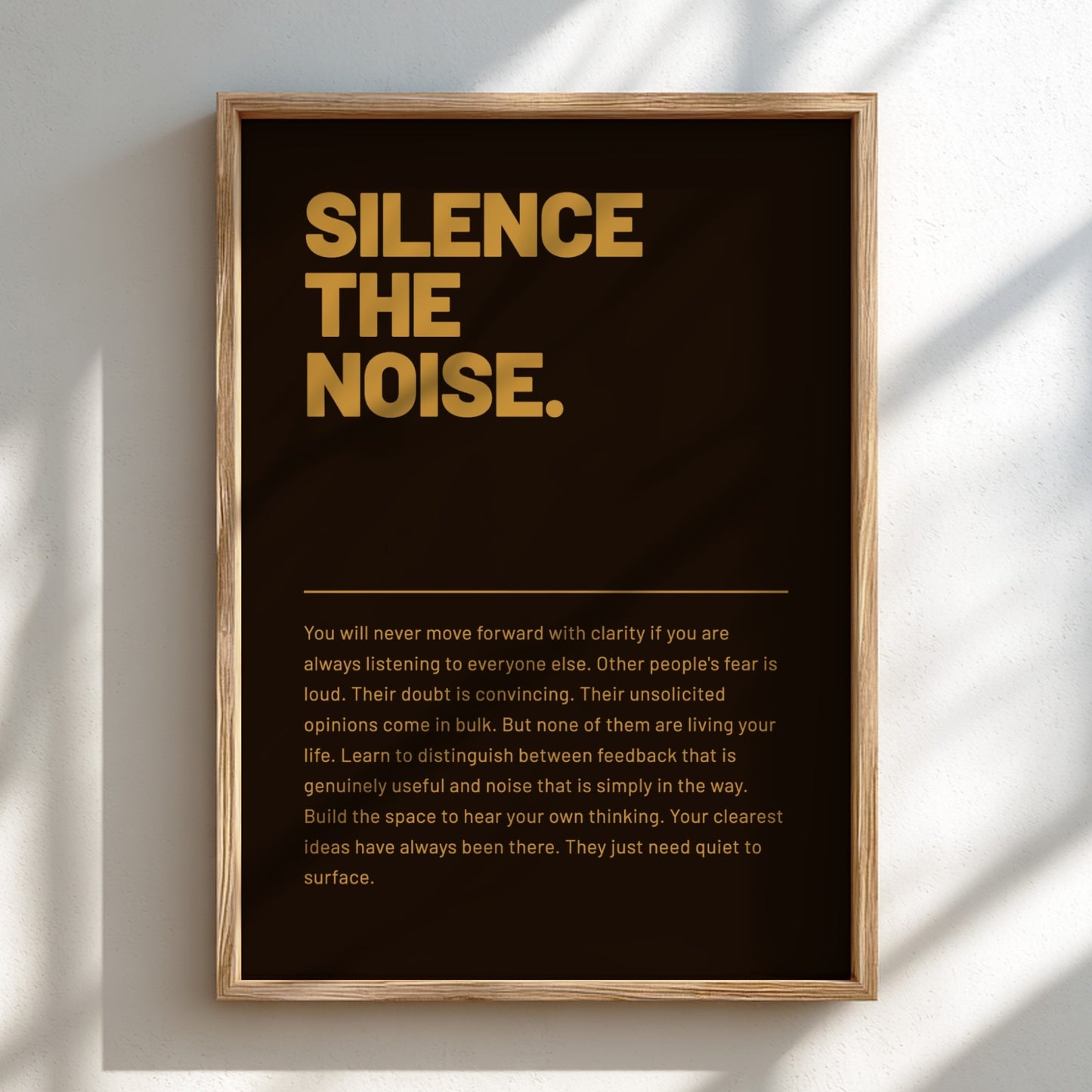Framed poster with 'Silence the Noise' text on a dark background