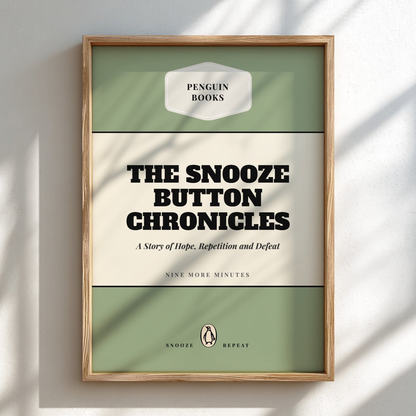 Framed book cover of 'The Snooze Button Chronicles' by Penguin Books on a light background