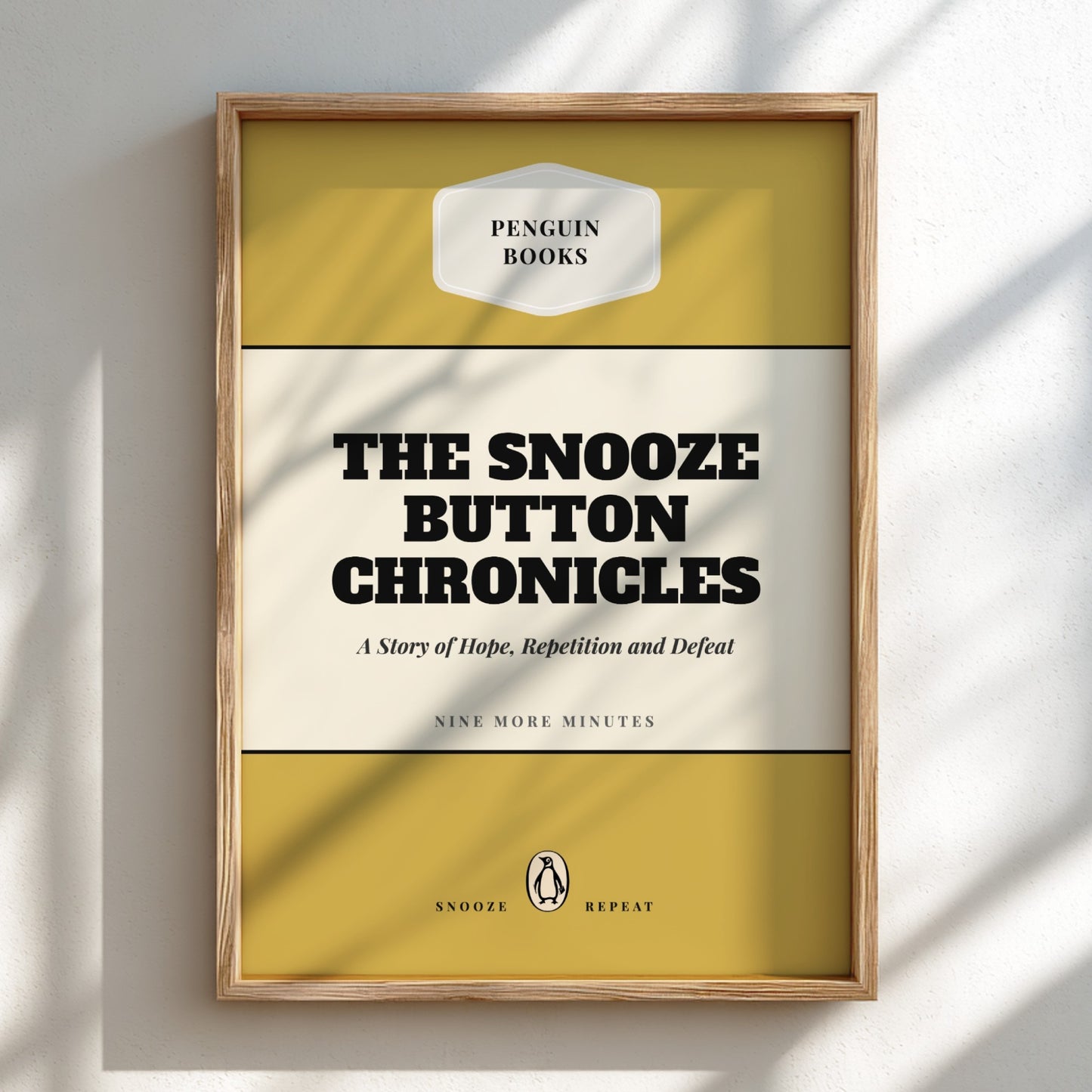 Framed book cover of 'The Snooze Button Chronicles' by Penguin Books on a light background
