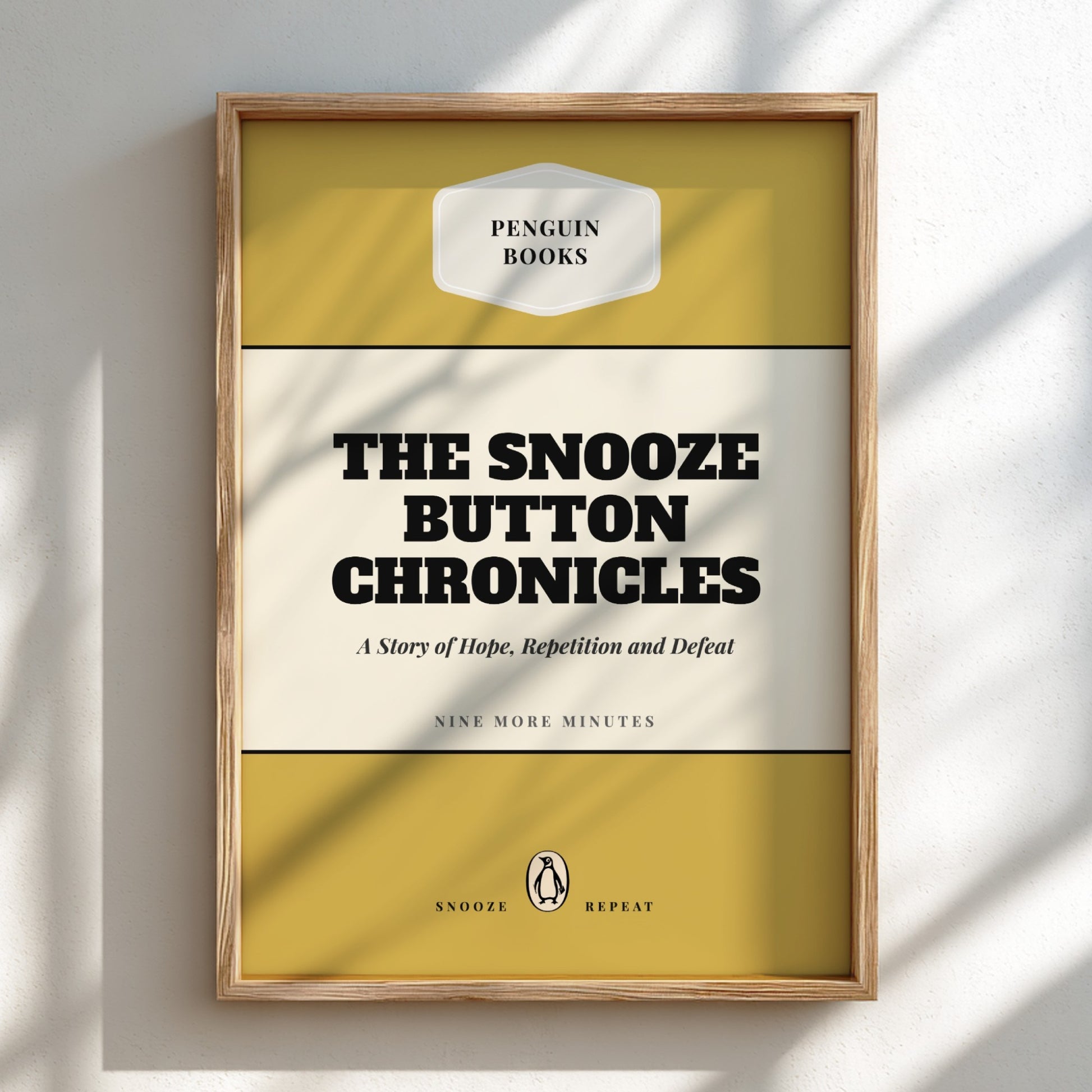 Framed book cover of 'The Snooze Button Chronicles' by Penguin Books on a light background