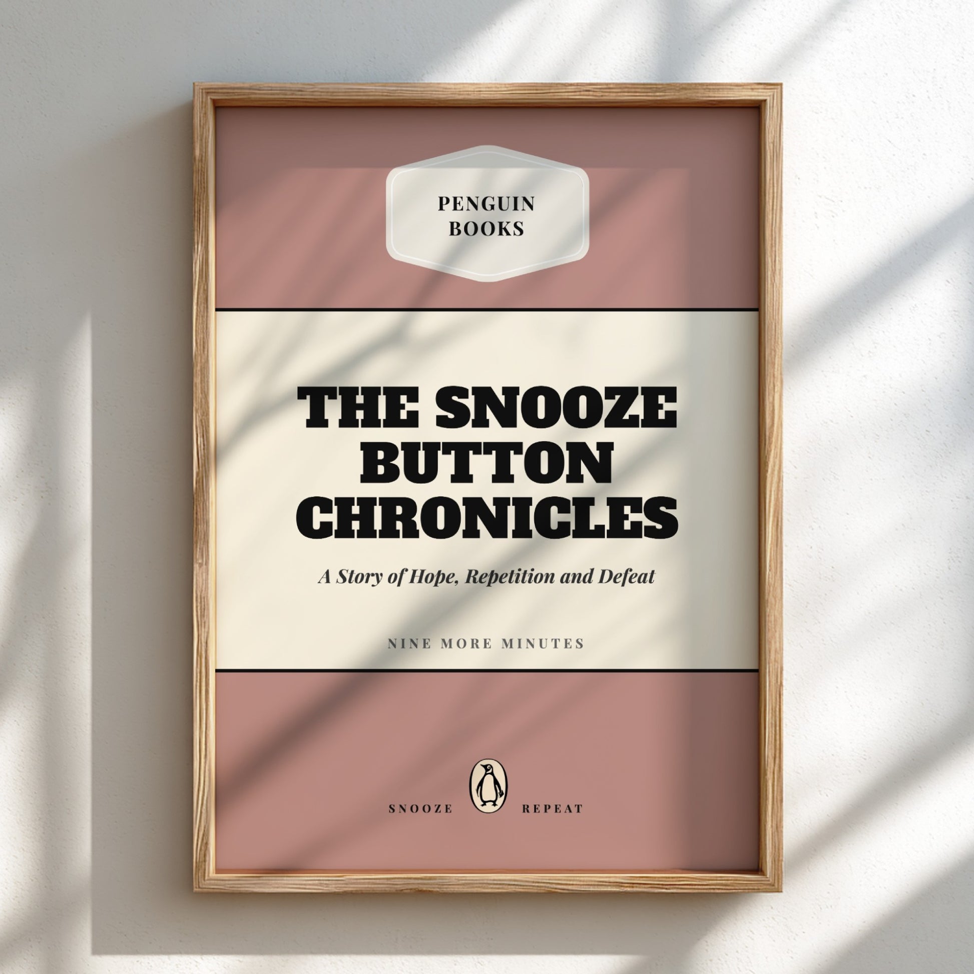 Framed book cover of 'The Snooze Button Chronicles' by Penguin Books on a light background